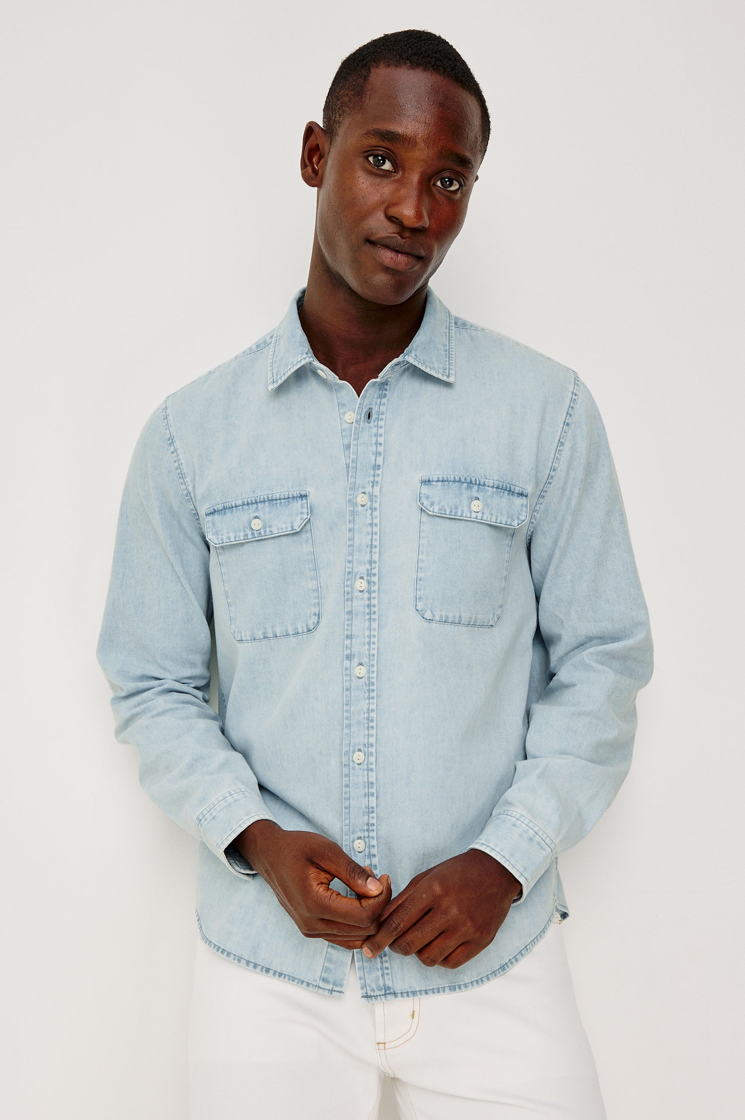 Meyer Shirt in Denim With Collar, Long Sleeves, and Chest Buttoned Flap Pockets in Light Vintage Wash - Upper Body Front View Featured on Model
