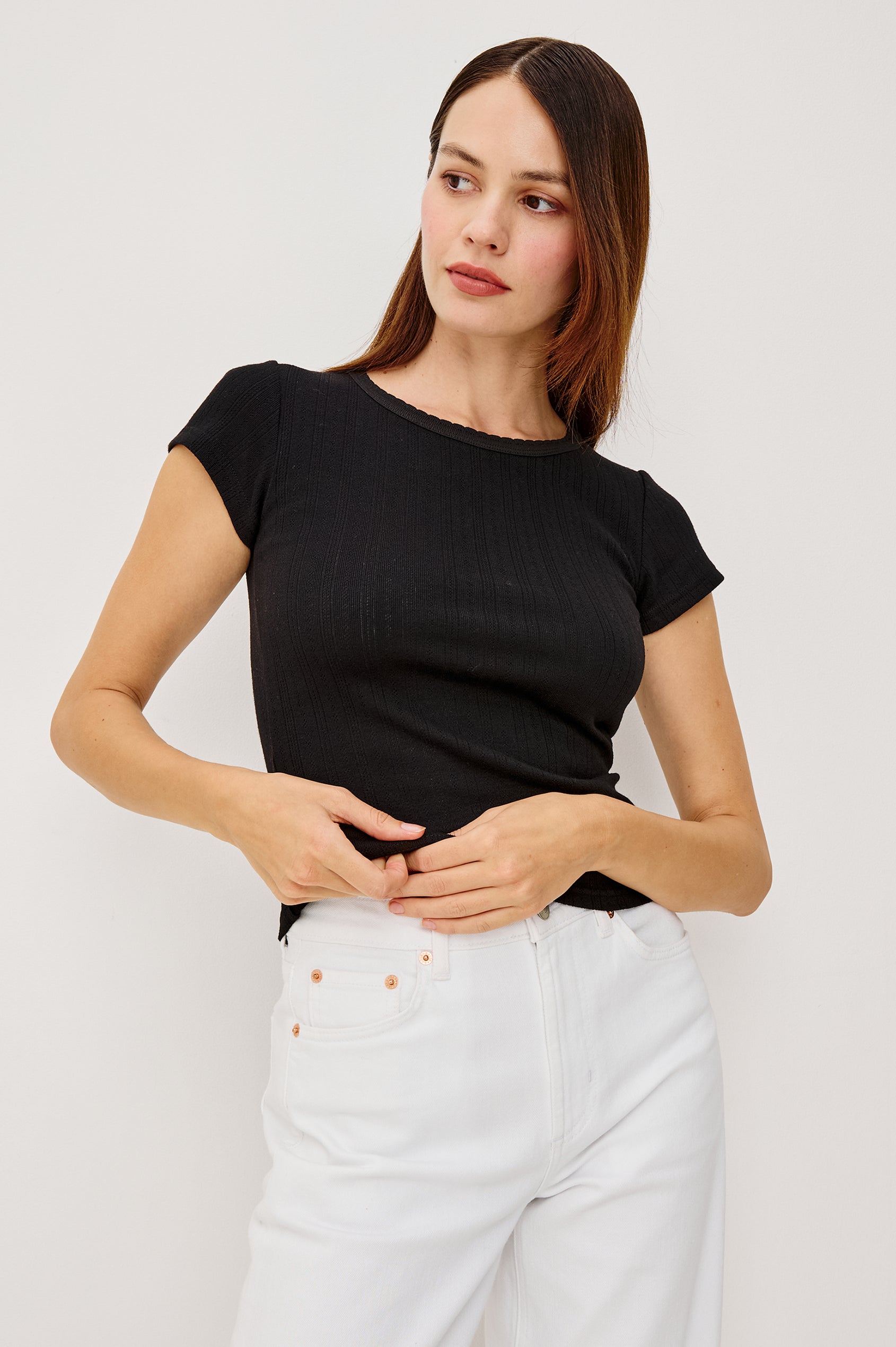 Mickey Fitted Crewneck Short Sleeve Baby Tee With Pleated Rib Pointelle Detailing in Black Colorway - Upper Body Back View Stylized Featuerd on Model