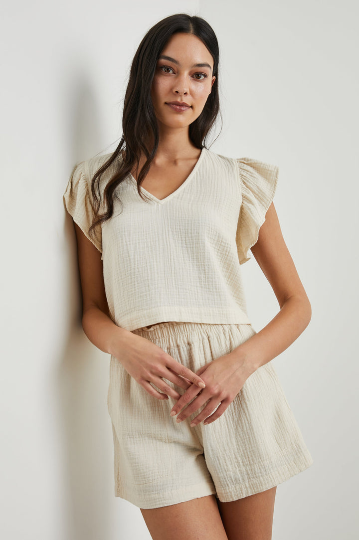 Miley Cropped, Short-Sleeve, V Neck Top with Flutter Sleeves and Textured Fabric in Flex Colorway - Front View Featured on Model