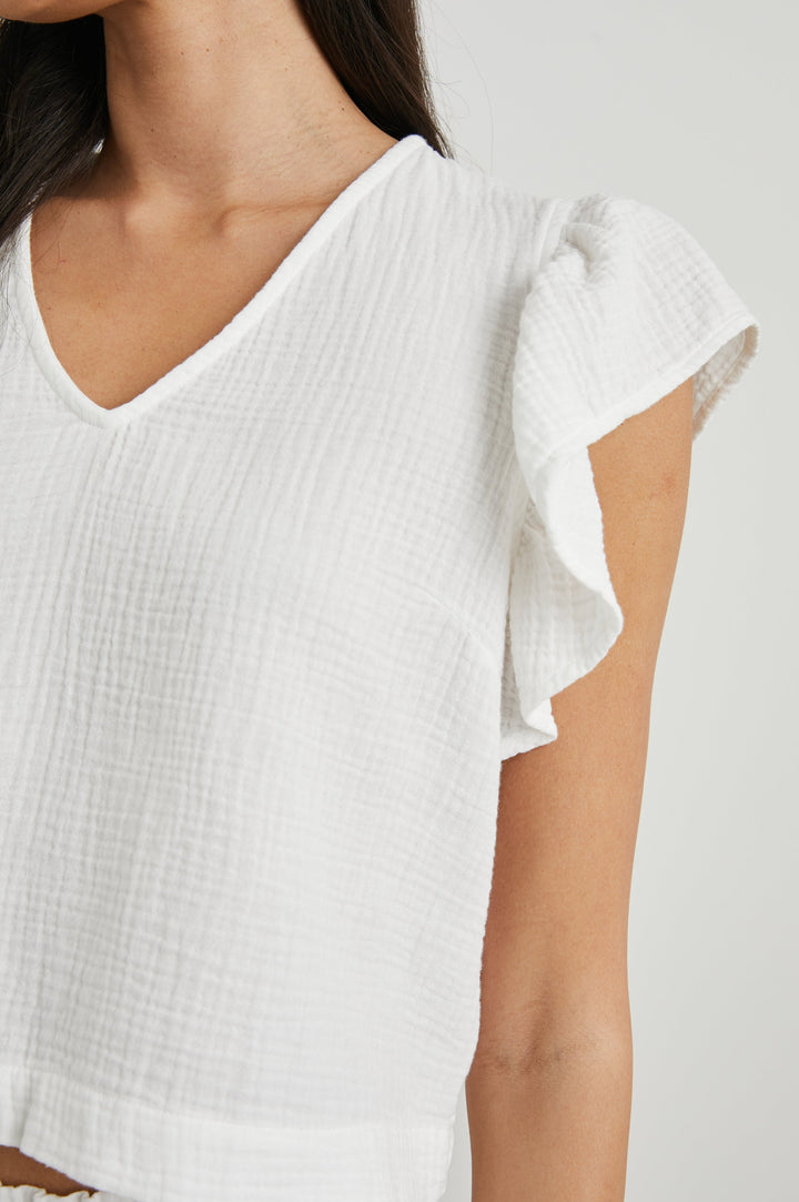Miley Cropped, Short-Sleeve, V Neck Top with Flutter Sleeves and Textured Fabric in White Colorway - Front View Featured on Model