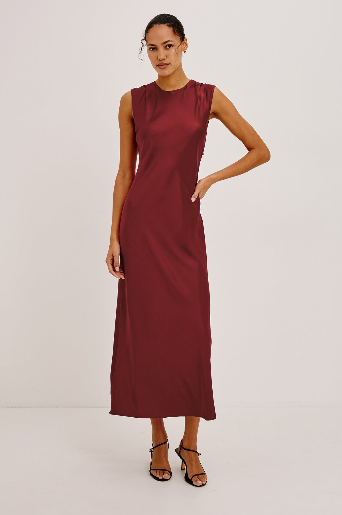 Mira Maxi Dress Bias Cut in Satin-Back Crepe With Crew Neckline, Pleated Shoulders, Side Zipper, and Keyhole Back With Button-Loop Closure in Crimson Colorway - Full Body Front View Featured on Model