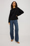 Giovanna Top in Soft Pointelle Cotton With Scoop Neck, Scalloped Trim, Ruffled Flutter Sleeves in Black Colorway - Full Body Front View Featured on Model