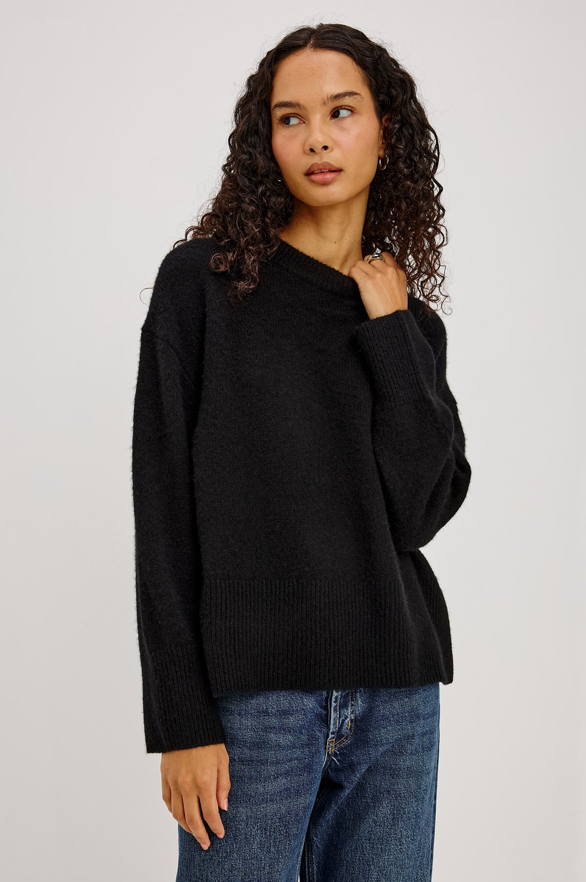 Miranda Sweater in Cashmere-Silk Blend With Crew Neckline, Ribbed Trim, Dropped Shoulders, Loose Relaxed Fit, and Long Sleeves in Black Colorway - Front Full Body View Featured on Model