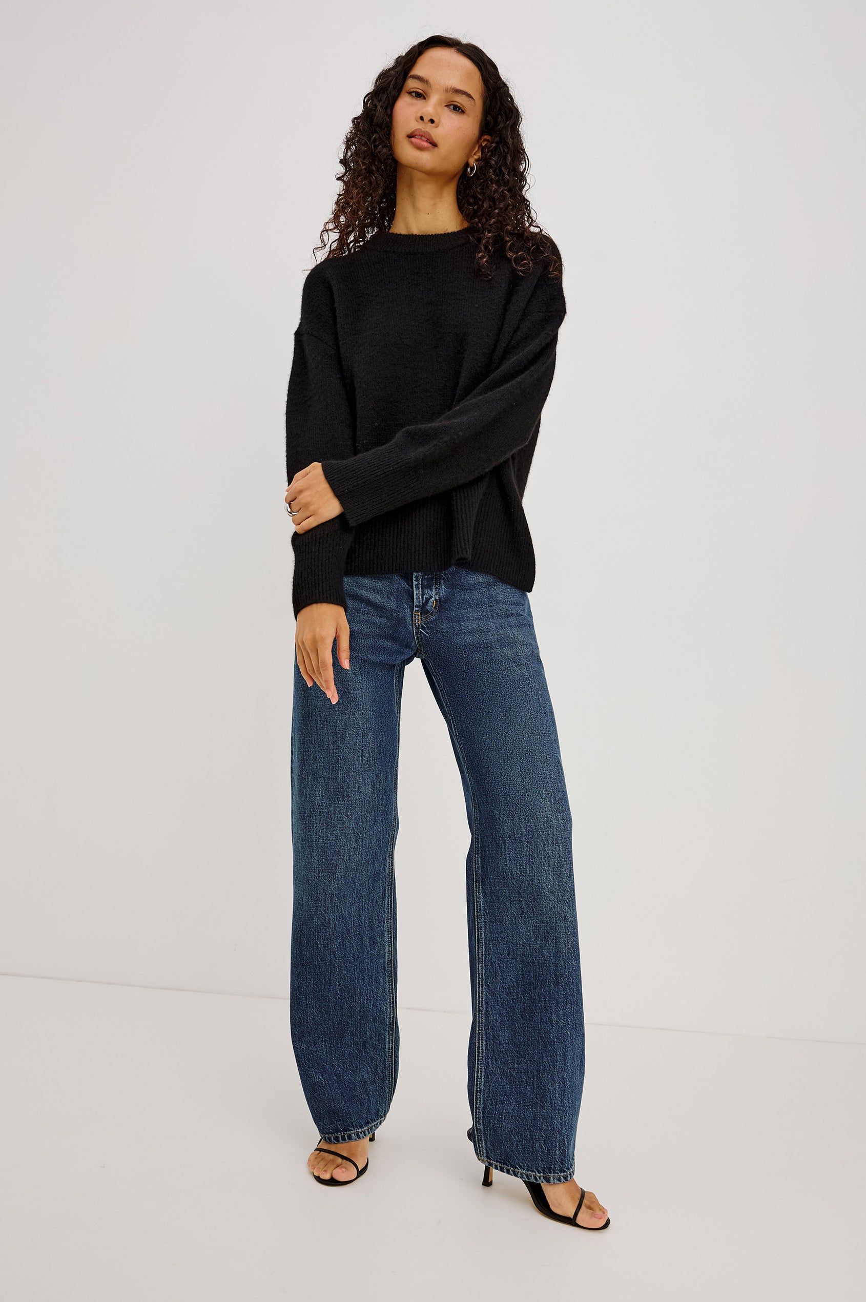 Giovanna Top in Soft Pointelle Cotton With Scoop Neck, Scalloped Trim, Ruffled Flutter Sleeves in Black Colorway - Full Body Front View Featured on Model
