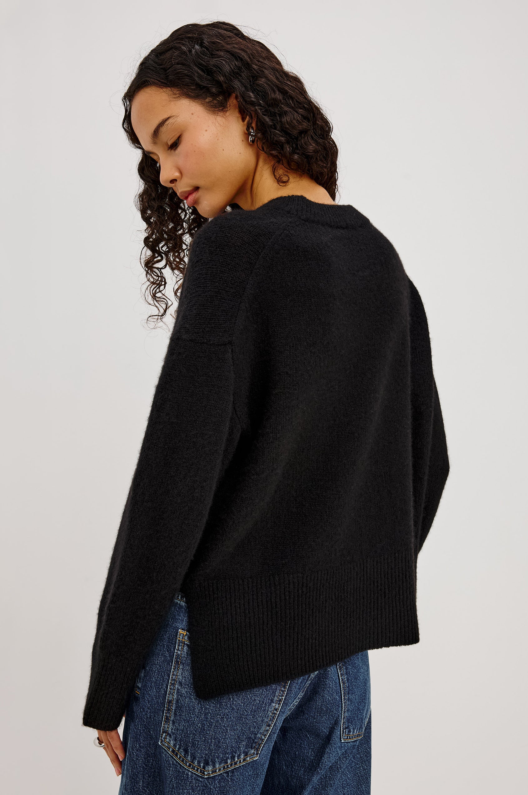 Giovanna Top in Soft Pointelle Cotton With Scoop Neck, Scalloped Trim, Ruffled Flutter Sleeves in Black Colorway - Upper Body Back View Featured on Model