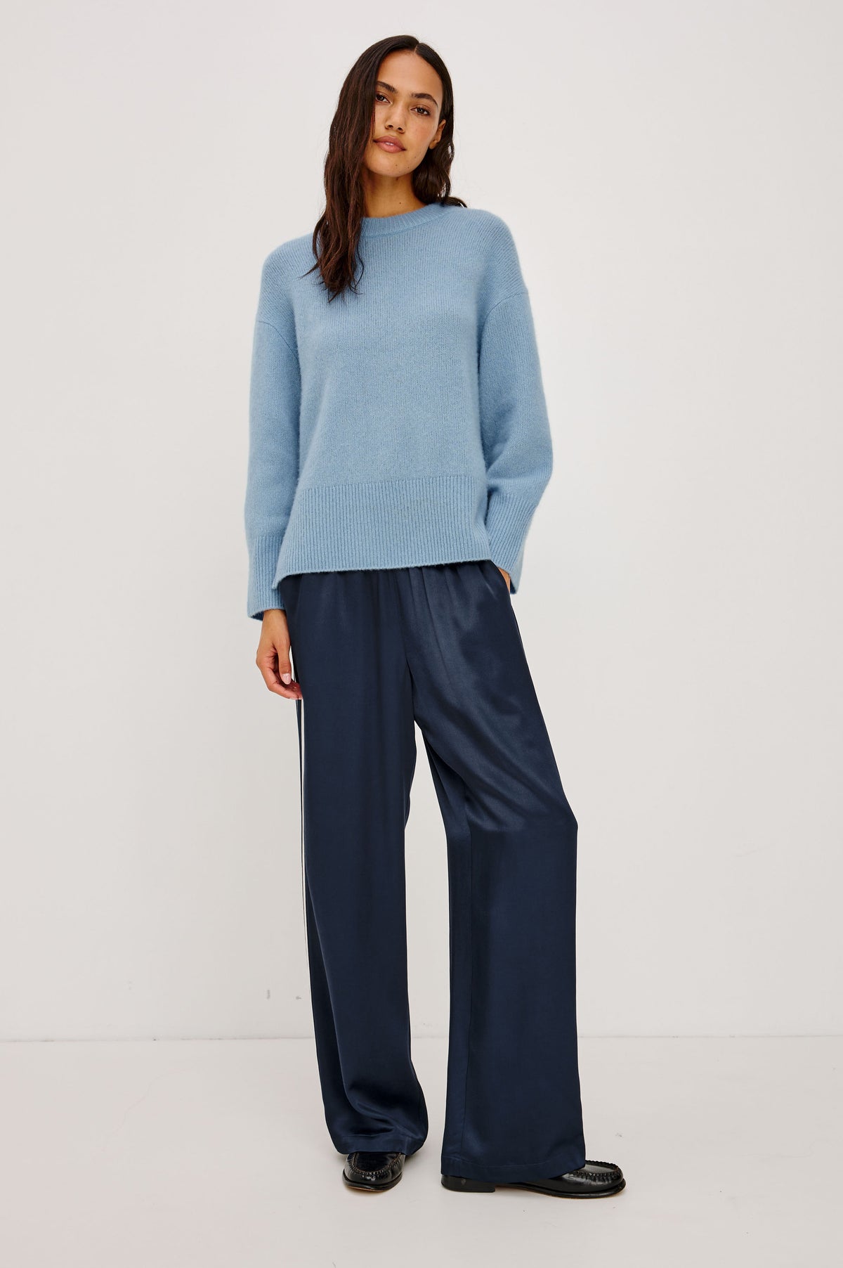 Miranda Sweater in Cashmere-Silk Blend With Relaxed Boxy Fit, Mock Neck, Drop Shoulders, and Side Slits at Hem in Fjord Blue Colorway - Full Body Front View Featured on Model.