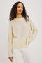 Miranda Sweater in Cashmere-Silk Blend With Relaxed Boxy Fit, Mock Neck, Drop Shoulders, and Side Slits at Hem in Ivory Colorway - Upper Body Front View Featured on Model