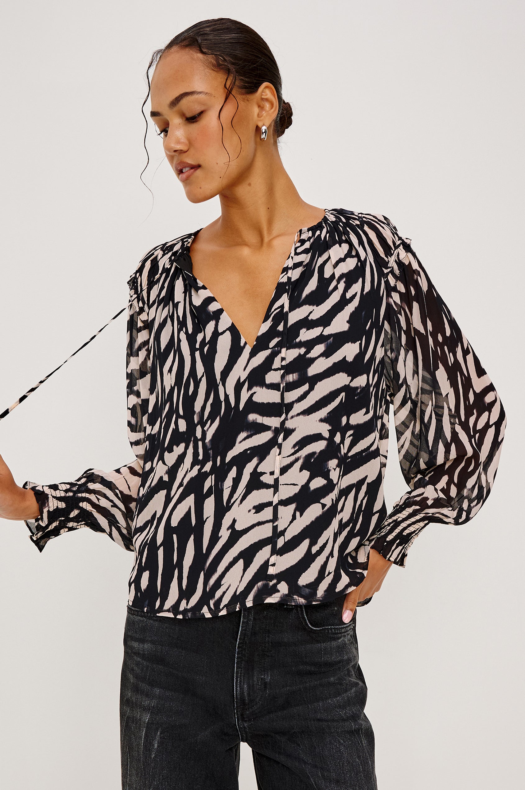 Mirna Blouse in Chiffon With Self-Tie V-Neckline, Loose Boxy Fit, Ruffle Trim, Balloon Sleeves with Smocked Cuffs in Ivory Tiger Stripe Colorway - Upper Body Front View Featured on Model