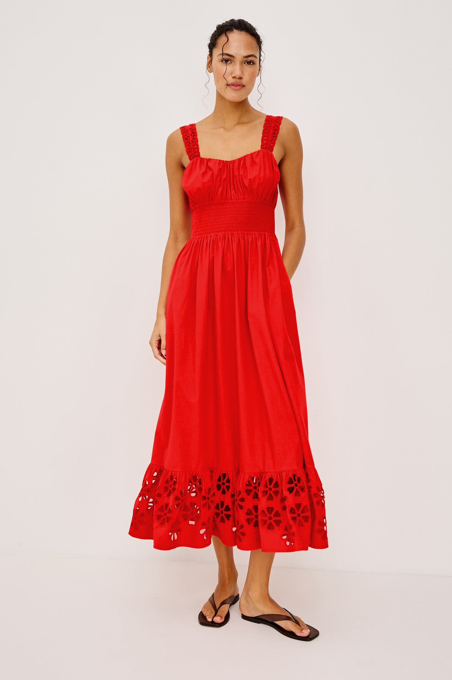 Moira Midi Dress in Cotton Poplin With Wide Embroidered Shoulder Straps Soft Sweetheart Neckline Smocked Empire Waist Fully Lined Skirt With Floral Cutwork at Hem in Scarlet Colorway - Full Body Front View Featured on Model