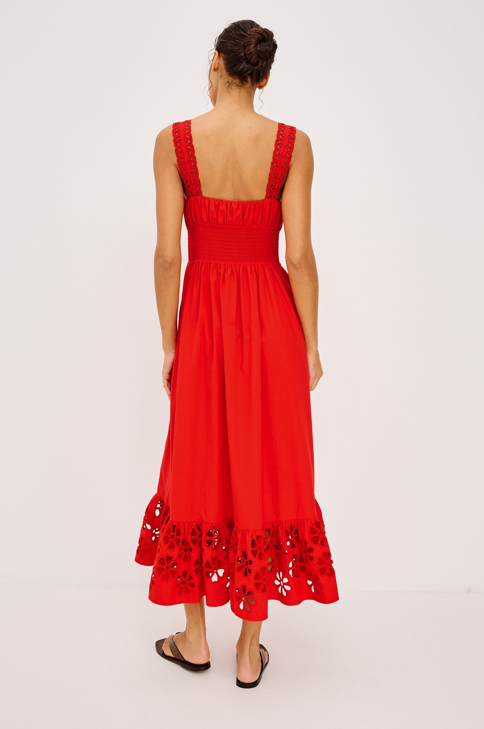 Moira Midi Dress in Cotton Poplin With Wide Embroidered Shoulder Straps, Soft Sweetheart Neckline, Smocked Empire Waist, Fully Lined Skirt With Floral Cutwork at Hem in Scarlet Colorway - Full Body Back View Featured on Model