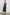Monique Sleeveless Midi Dress with an Asymmetrical Hem Line, Side Slit, Deep V Neck, and Wide Shoulder Straps in Navy Colorway - Back Full Body View Featured on Model