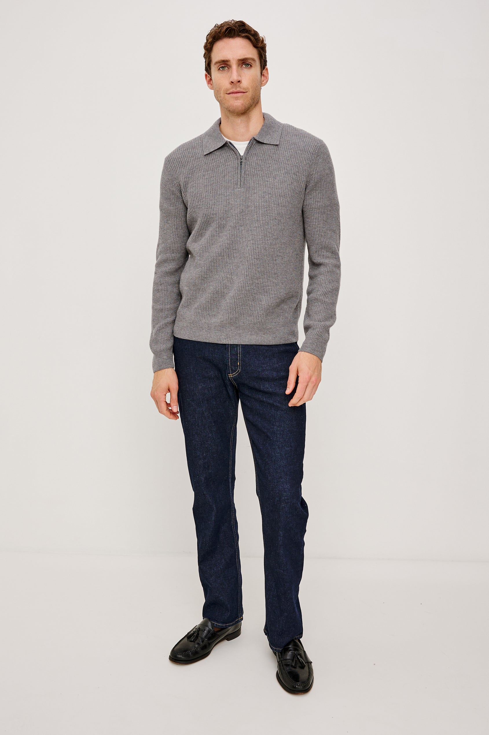 Monty is a collared quarter-zip long sleeved sweater in Finch colorway. Front full-body view featured on the model.