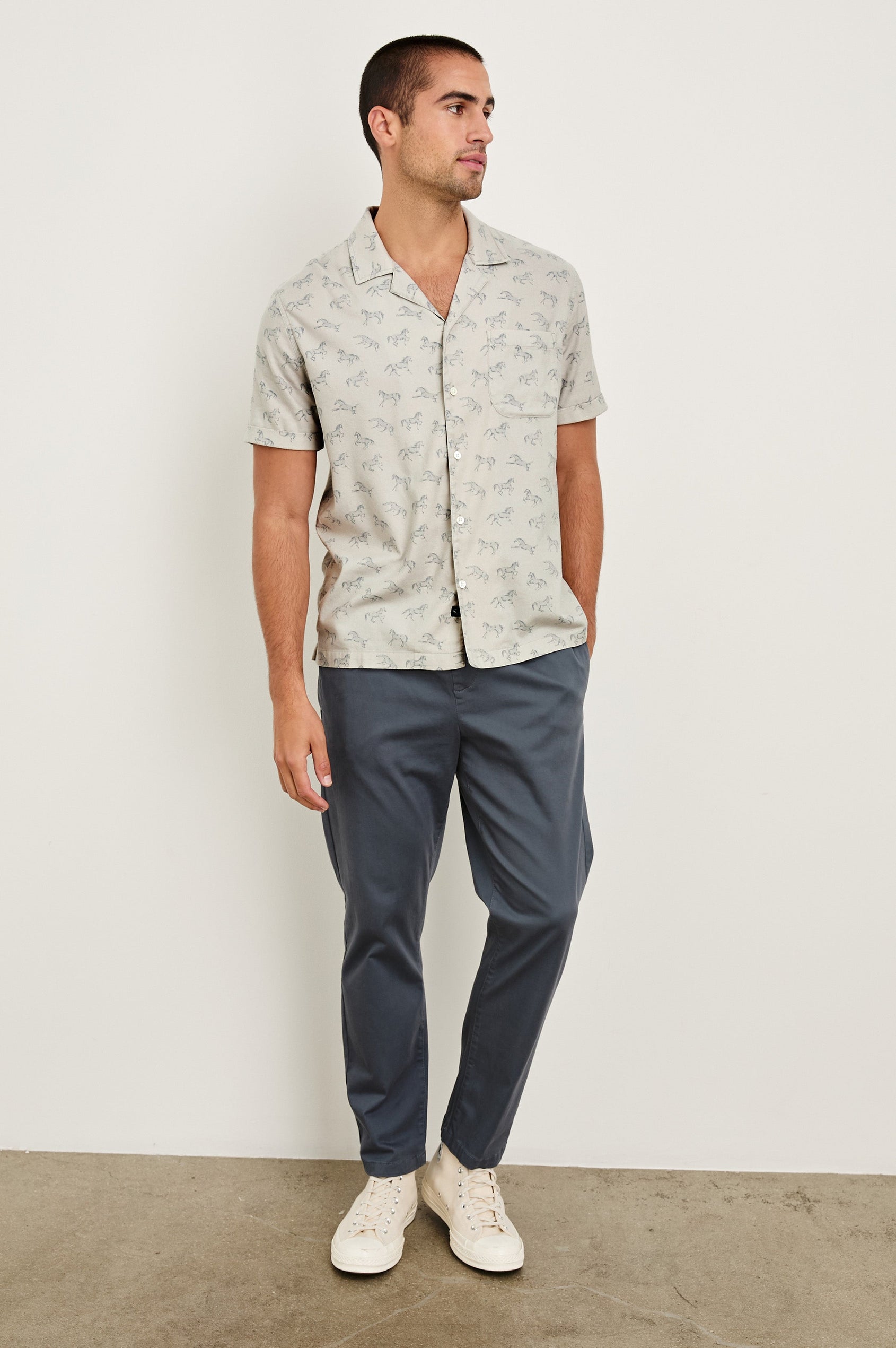 Moreno short sleeve button up shirt with camp collar and chest pocket in Stallion Parchment Indigo pattern - full body front view on model