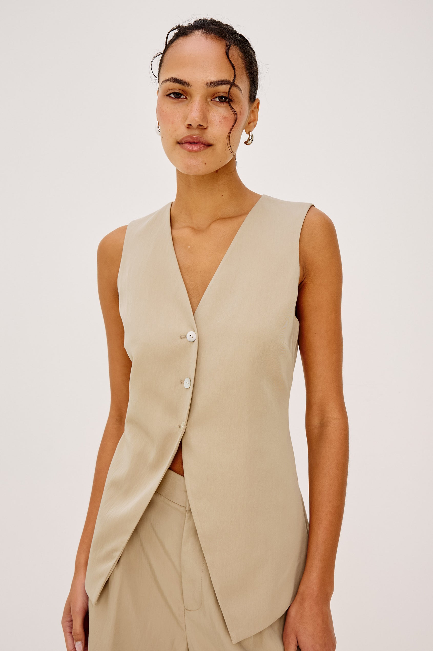 Mylah Vest in Viscose Suiting With V-Neckline, Front Buttons, and Slightly-Loose Fit Tapered at Waist in Almond Colorway - Full Body Front View Featured on Model