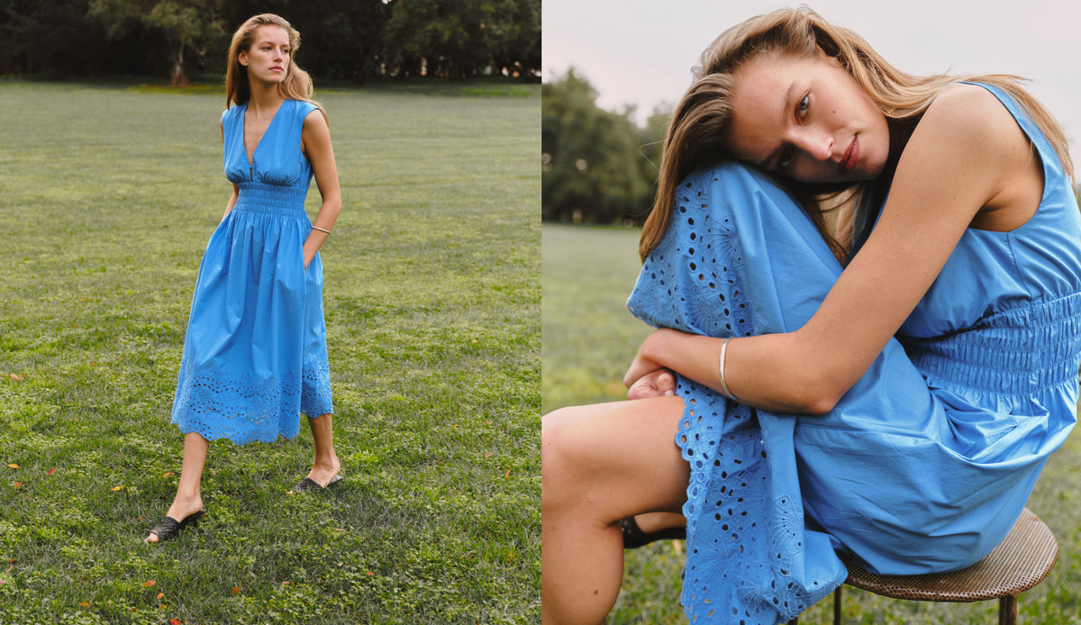 A woman modeling a bright blue sleeveless midi dress with eyelet lace details, shown in a split-screen outdoor setting: standing on a grassy field on the left and seated on a stool in a close-up on the right.