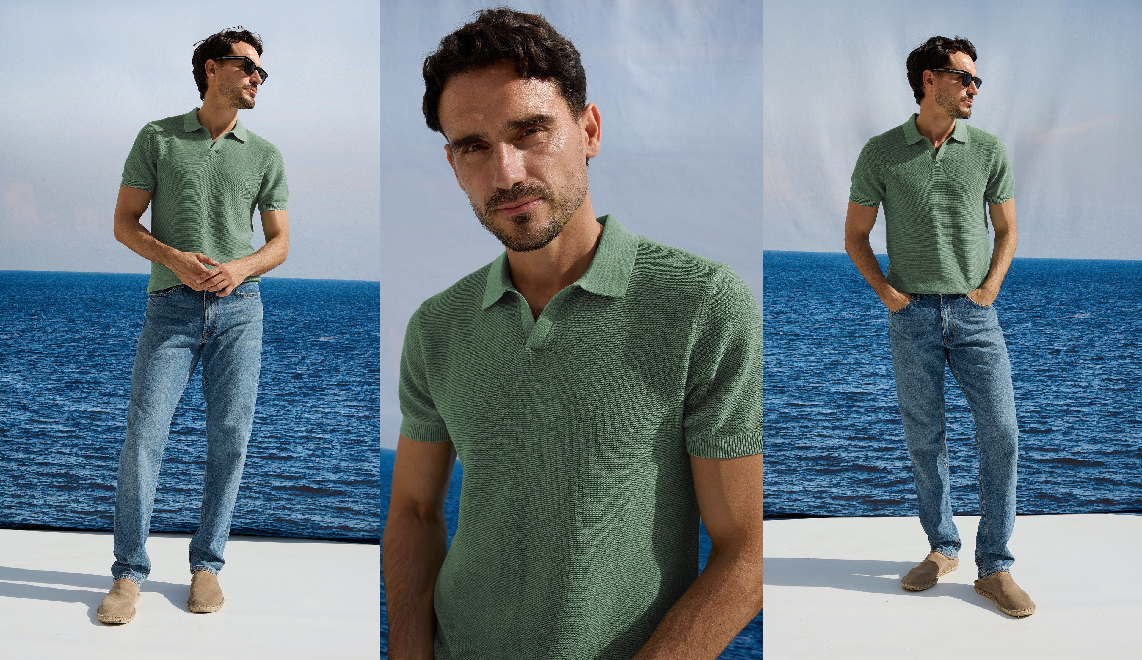 Man wearing a green polo shirt and blue jeans standing by the ocean.
