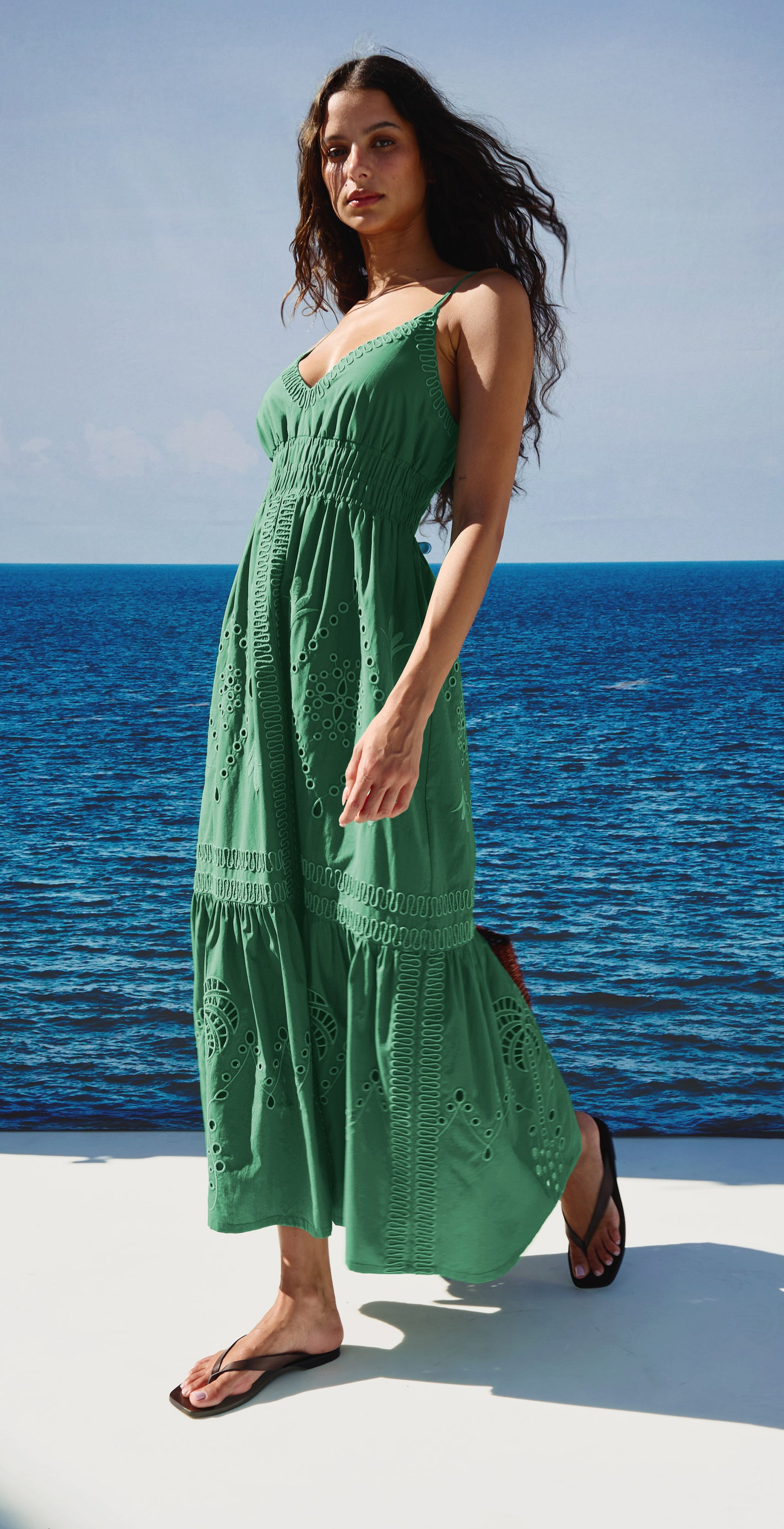 Woman in a green dress dressed for summer