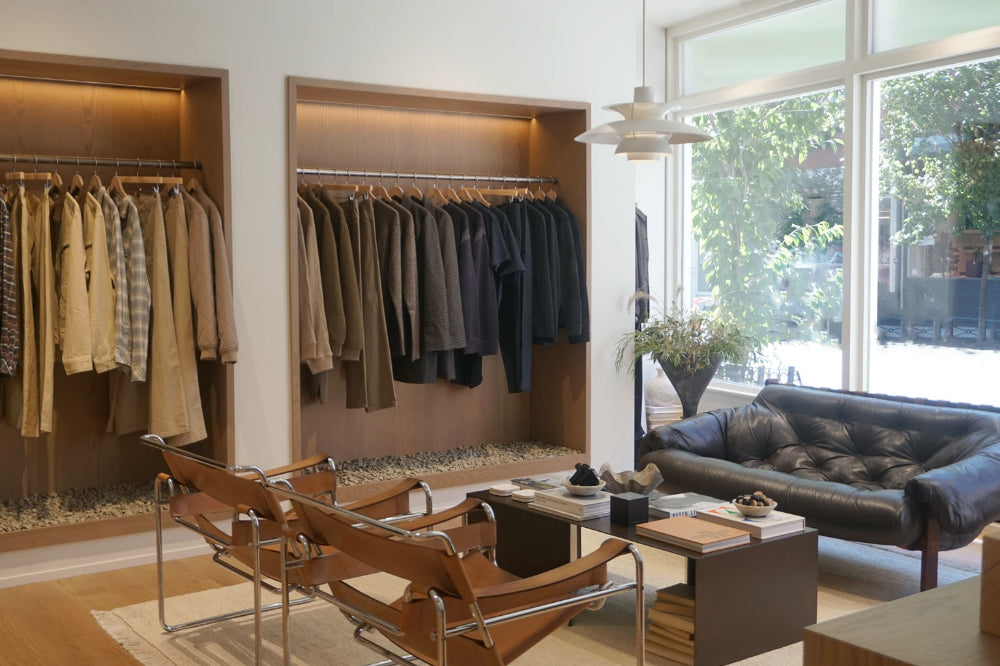 Modern living room with clothing display and leather sofa