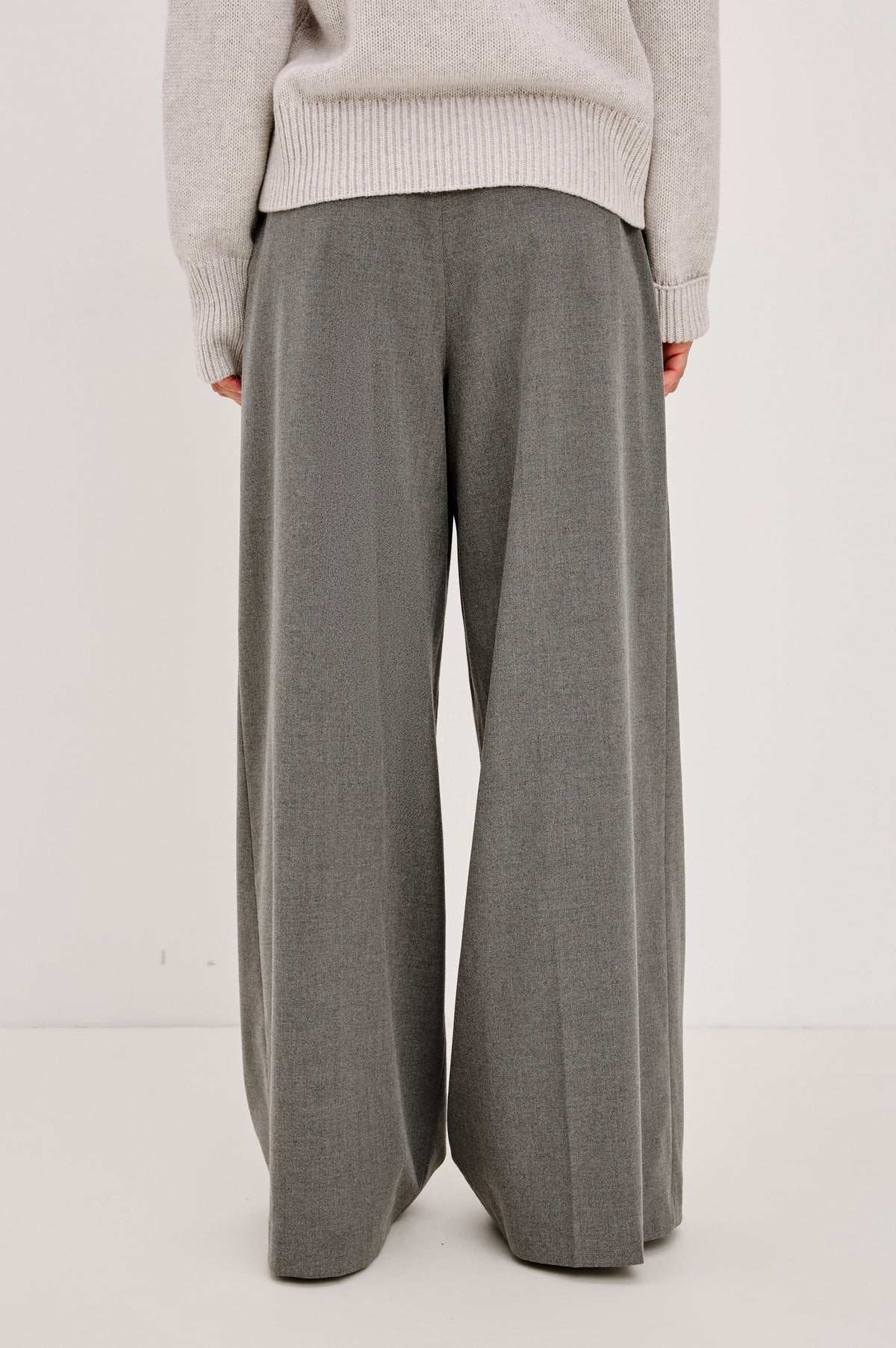 Nando Pant in Drapey Suiting Blend With High Waist, Wide, Relaxed Legs, and Drawstring Ties in Heather Charcoal Colorway - Back Crop View Featured on Model.