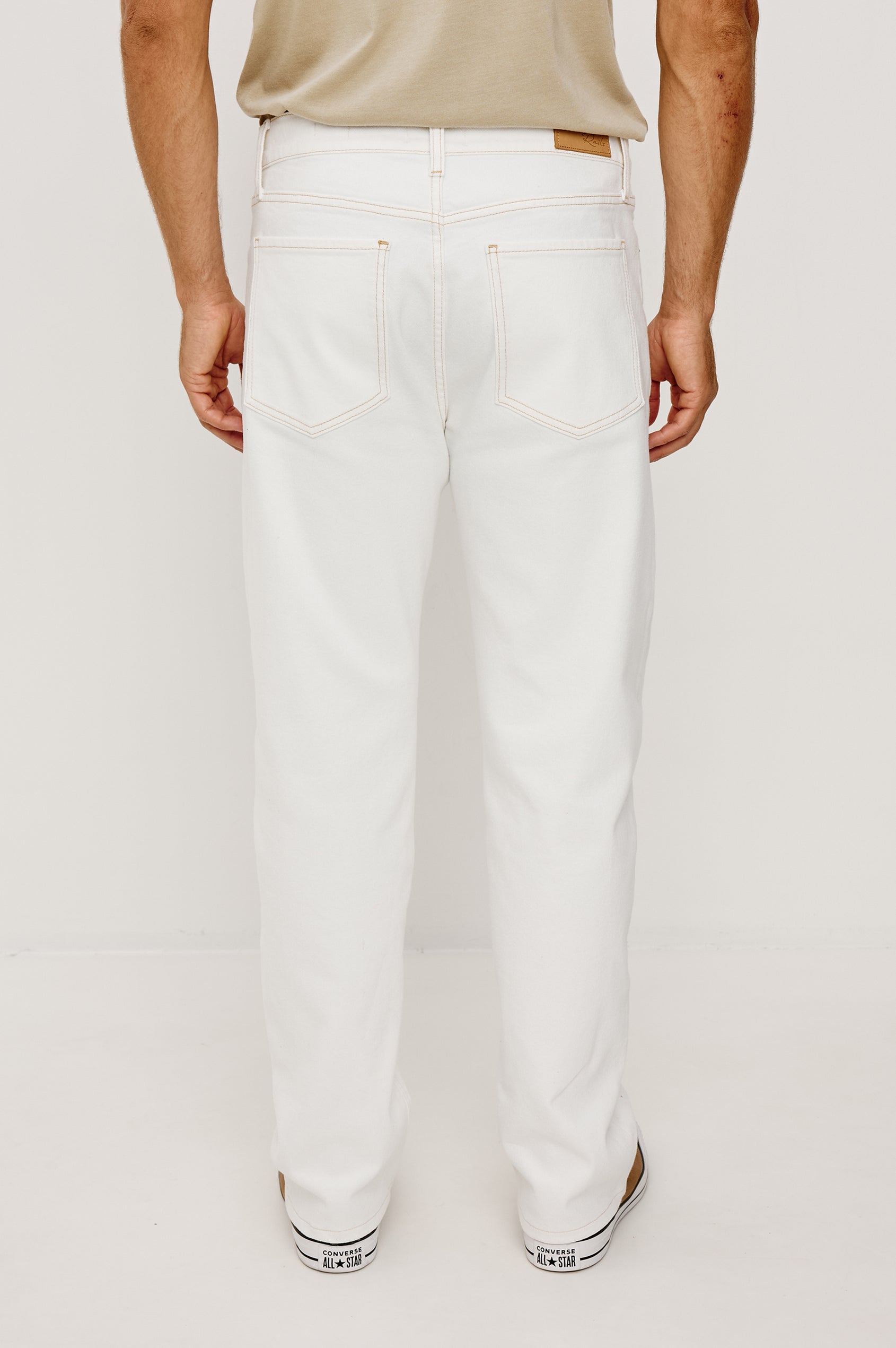 Nash Straight Leg Jean in Stretch Cotton With Classic 5-Pockets, Belt Loops, and a Front Zip Fly in Ecru Colorway - Lower Body Back View Featured on Model