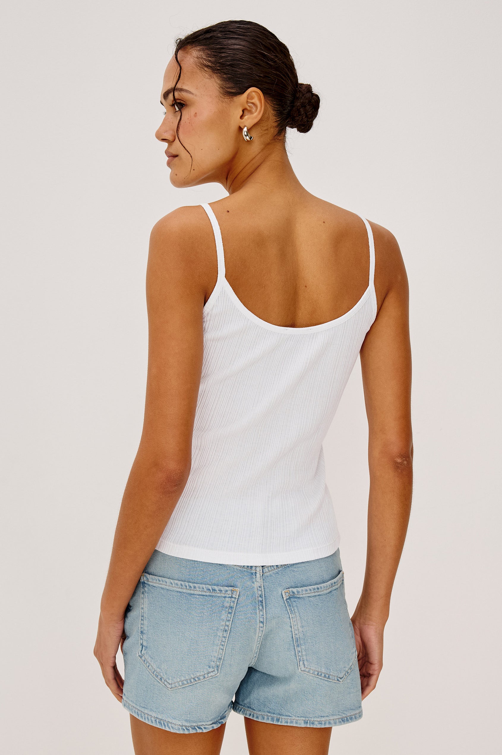 Nika Tank Top in Ribbed Cotton With Scoop Neckline and Spaghetti Shoulder Straps in White Colorway - Upper Body Back View Featured on Model
