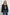 North Cropped Jacket with Button Closure, Puff Sleeves, Oversize Collar, a Toggle Hem, Two Front Pockets and a Horizontal Back Vent in Black Twill Colorway - Front View Featured on Model