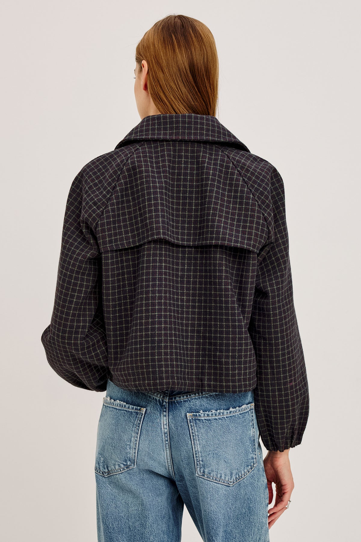 North Jacket in Wool Blend With Cropped, Boxy Fit, Drawcord Hem, Oversized Collar, Front Buttons, and Welt Pockets in Mulberry Check Colorway - Upper Body Back View Featured on Model.