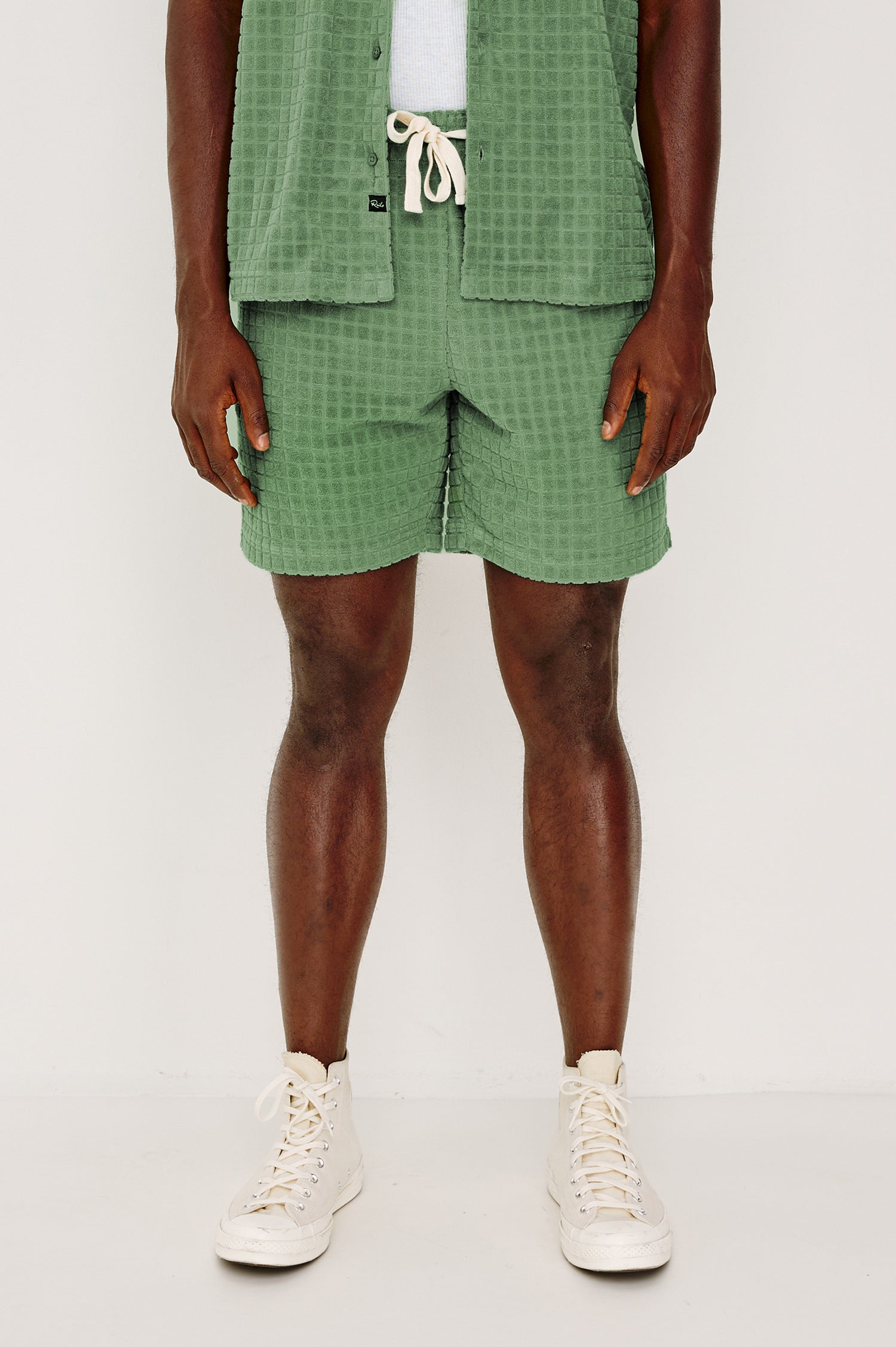 Nova Short in French Terry With Raised Jacquard Pattern, Side Pockets, and Drawstring Waist Ties in Green Bay Grid Colorway - Lower Body Front View Featured on Model