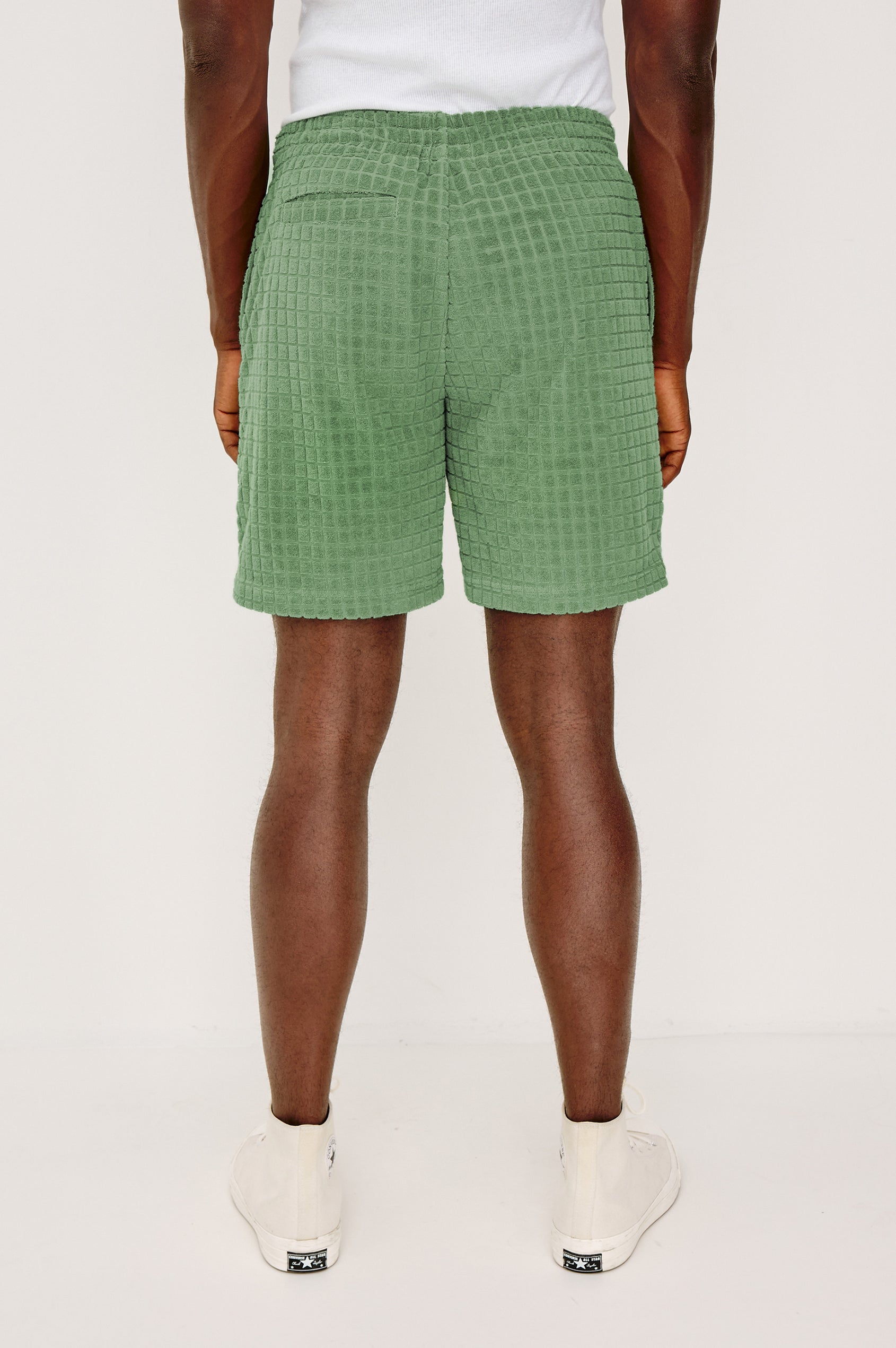 Nova Short in French Terry With Raised Jacquard Pattern, Side Pockets, and Drawstring Waist Ties in Green Bay Grid Colorway - Full Body Front View Featured on Model