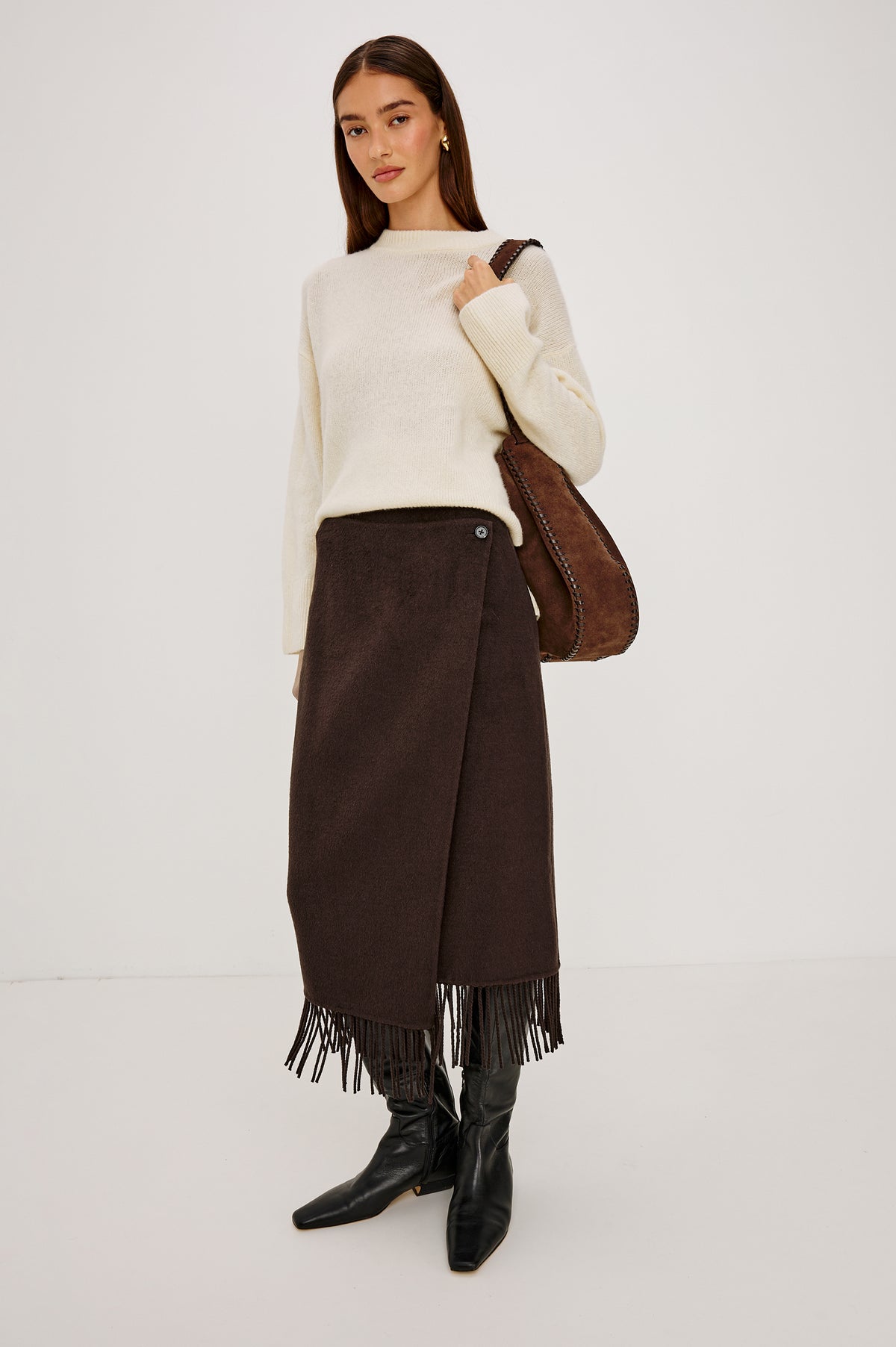 Odette Midi Skirt in Wool Blend With Wrap Design, Hidden Side Button Closure, and Fringe Hem in Chocolate Colorway - Full Body Front View Featured on Model