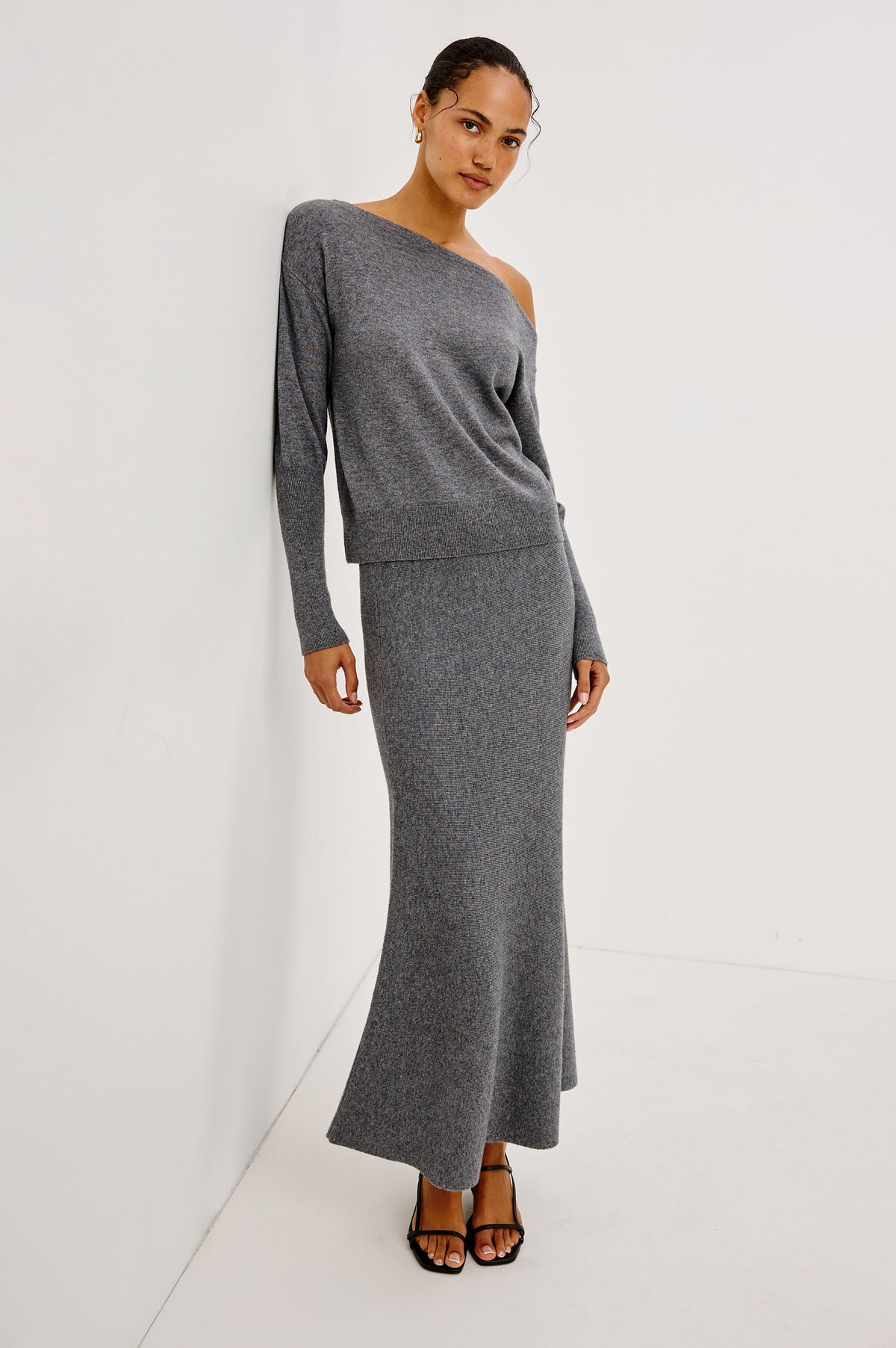 Odita Maxi Skirt in Soft Ribbed Wool Blend Knit With Elastic Waist, and A-Line Silhoeutte in Heather Charcoal Colorway - Front Full Body View Featured on Model.