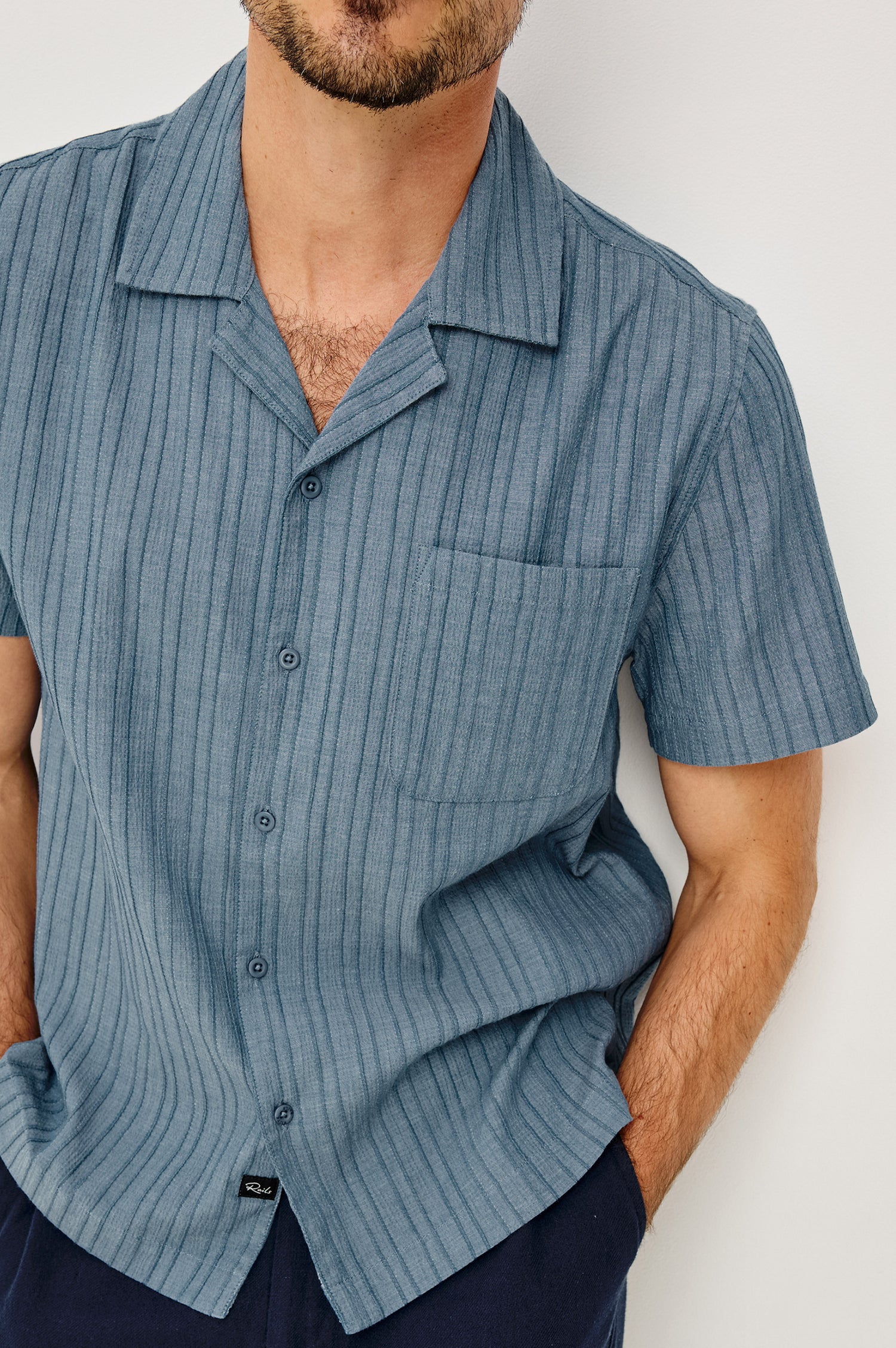Ohana Button-Up Shirt in Textured Shirting WIth Short Sleeves, Collar, and Relaxed Fit in Marine Colorway - Upper Body Front View Featured on Model