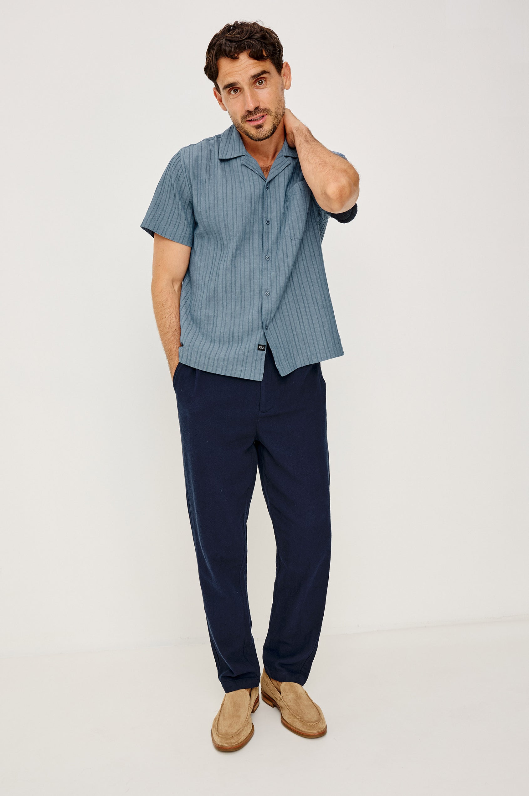 Ohana Button-Up Shirt in Textured Shirting WIth Short Sleeves, Collar, and Relaxed Fit in Marine Colorway - Full Body Front View Featured on Model