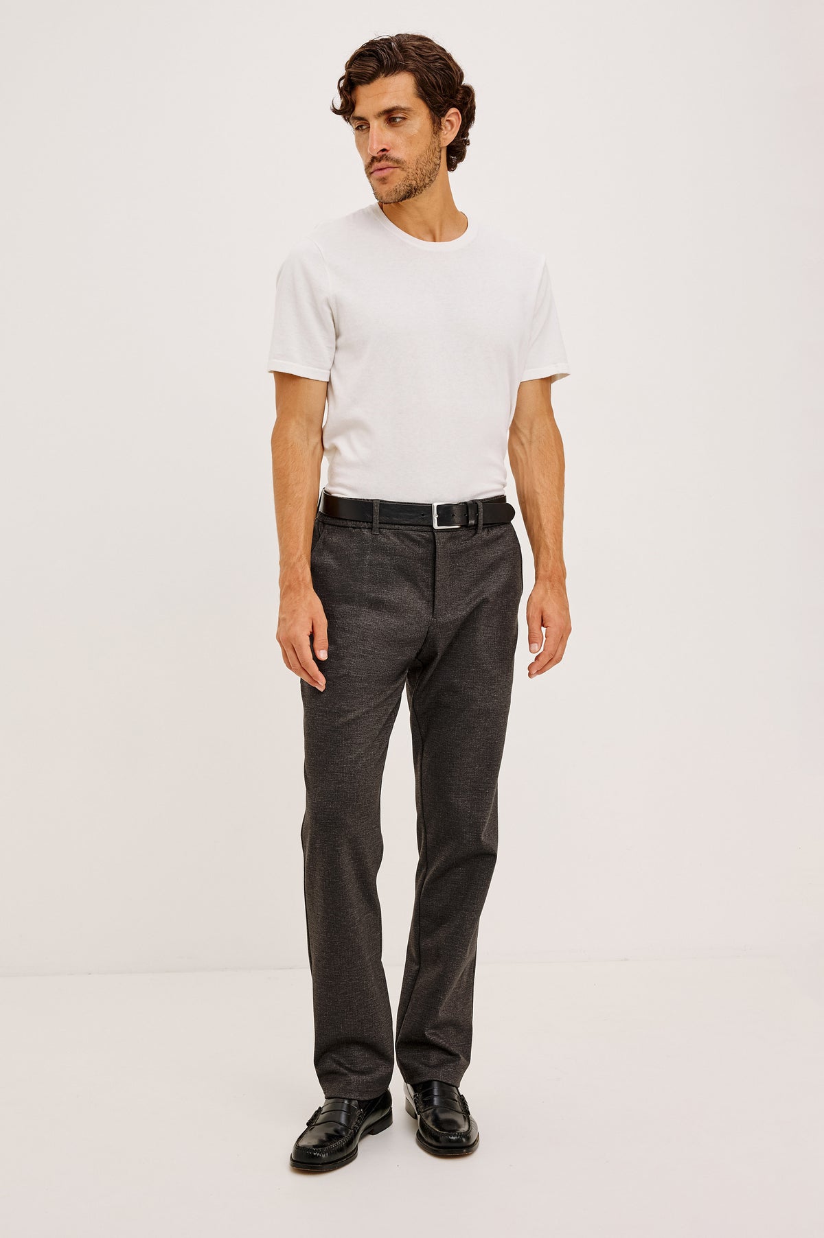 Olivier Pant in Stretch Ponte Knit With Slim Legs, Clean Front Waistband With Belt Loops, Elasticated Sides and Back, Front Zip Fly, Side Slash Pockets, and Back Welt Pockets in Umber Colorway - Full Body Front View Featured on Model
