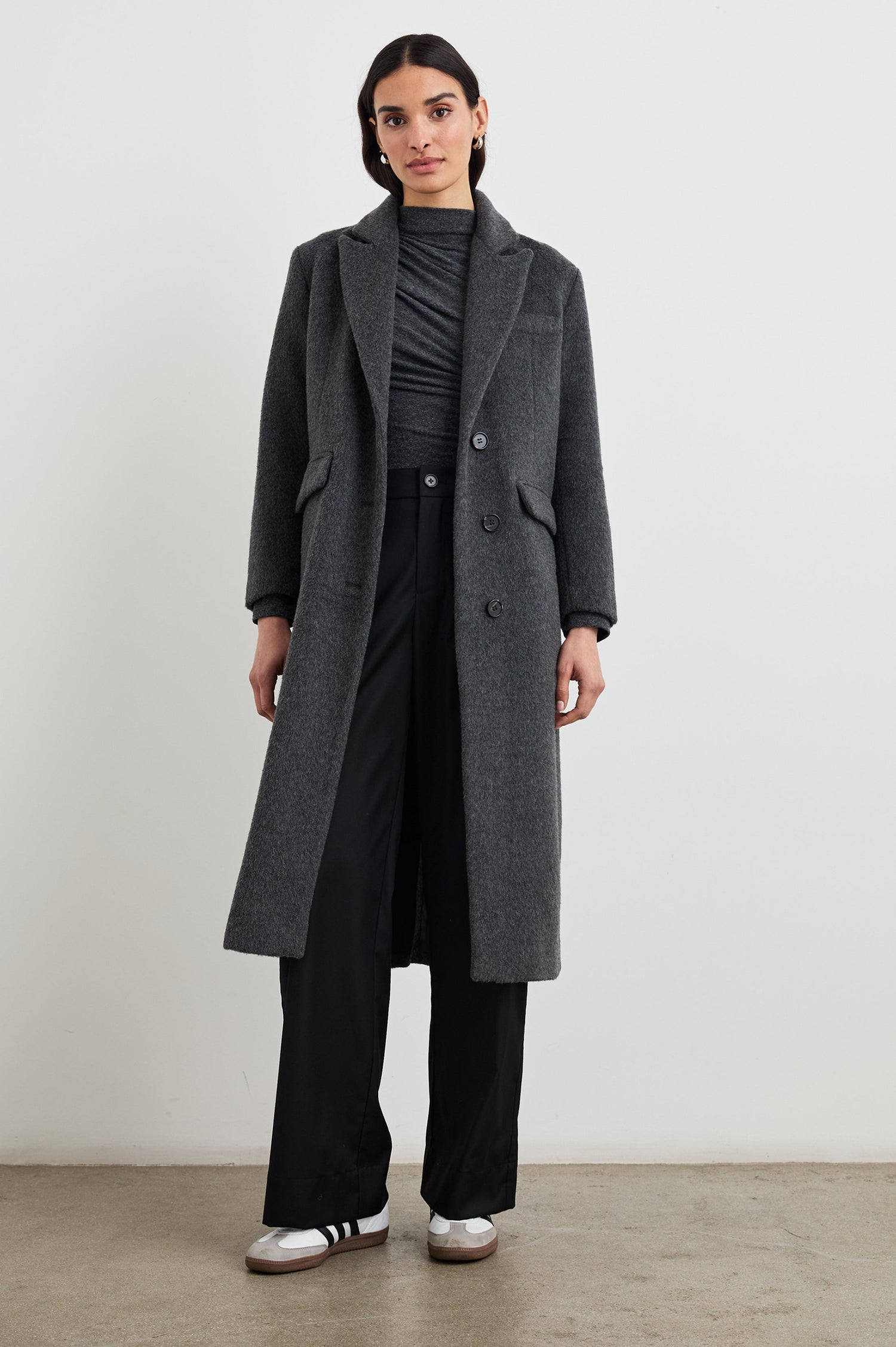 Opera Below-the-Knee Length Coat with V Neck, Three-Button Closure and Two Front Flap Patch Pockets in Charcoal Colorway - Front Full Body View Featured on Model