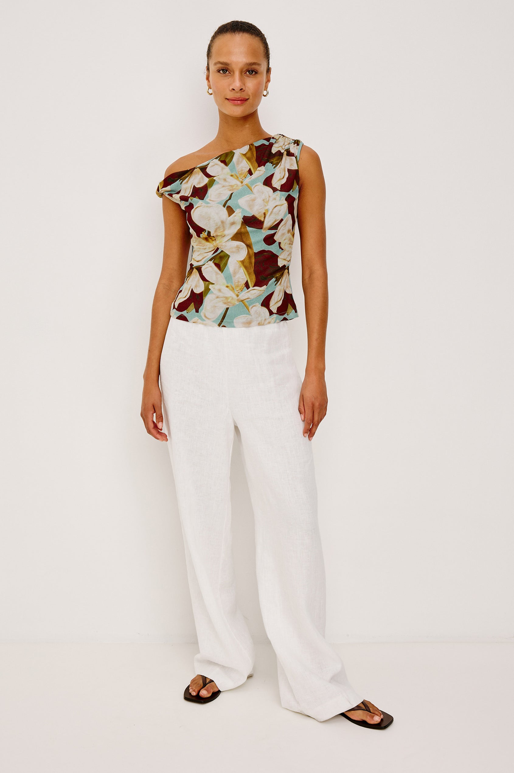 Orelia Fitted Top in Self-Lined Mesh With Twisted Shoulder Straps, and Asymmetrical One Shoulder Neckline in Plumeria Colorway - Full Body Front View Featured on Model