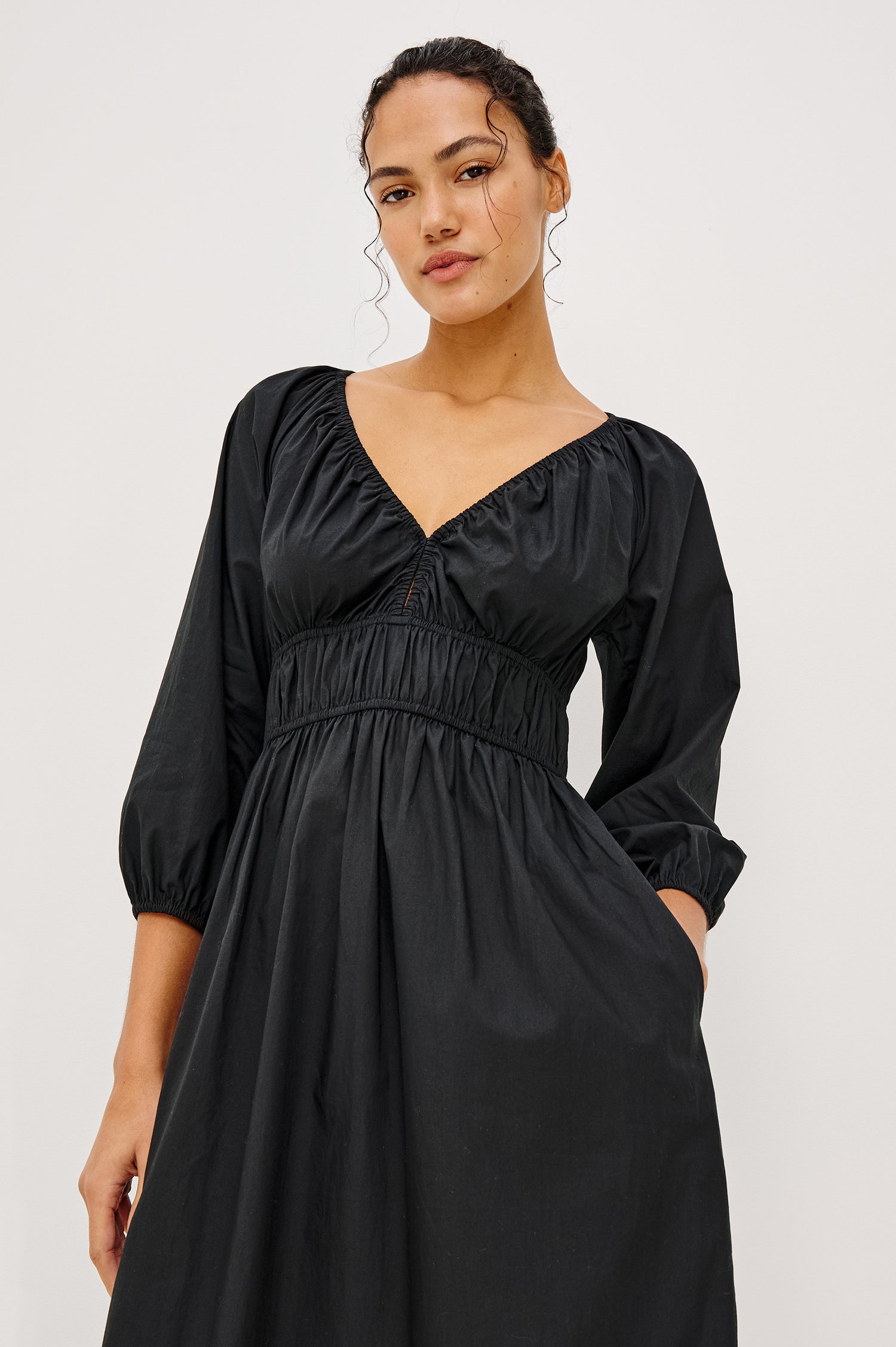 Paio Midi Dress in Crinkle Poplin With Elastic V-Neck, Waist, and Cuffs, Bust Keyhole Cut Out, and Three-Quarter Sleeves in Black Colorway - Upper Body Front View Featured on Model