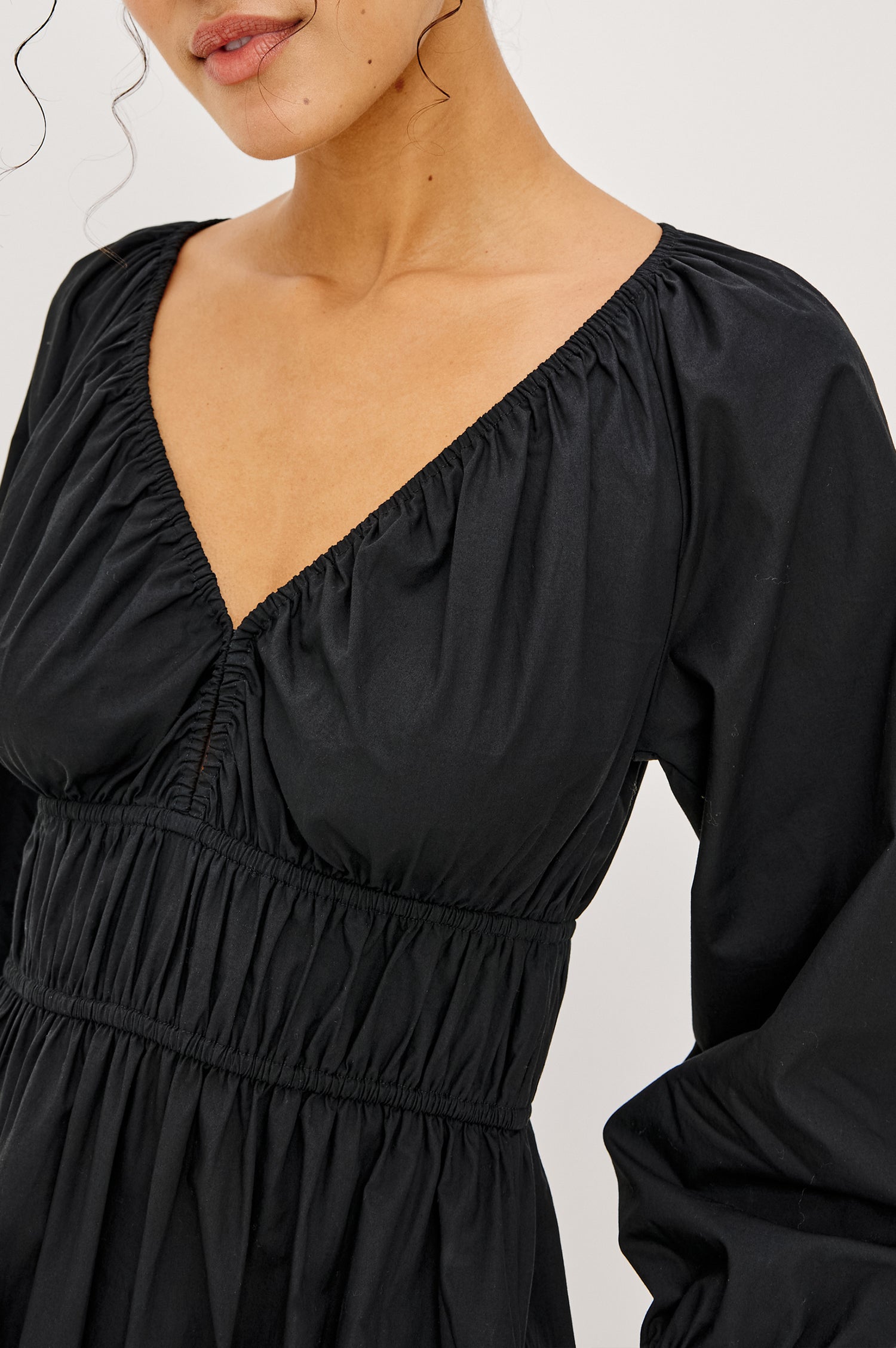 Paio Midi Dress in Crinkle Poplin With Elastic V-Neck, Waist, and Cuffs, Bust Keyhole Cut Out, and Three-Quarter Sleeves in Black Colorway - Upper Body Close Up View Featured on Model