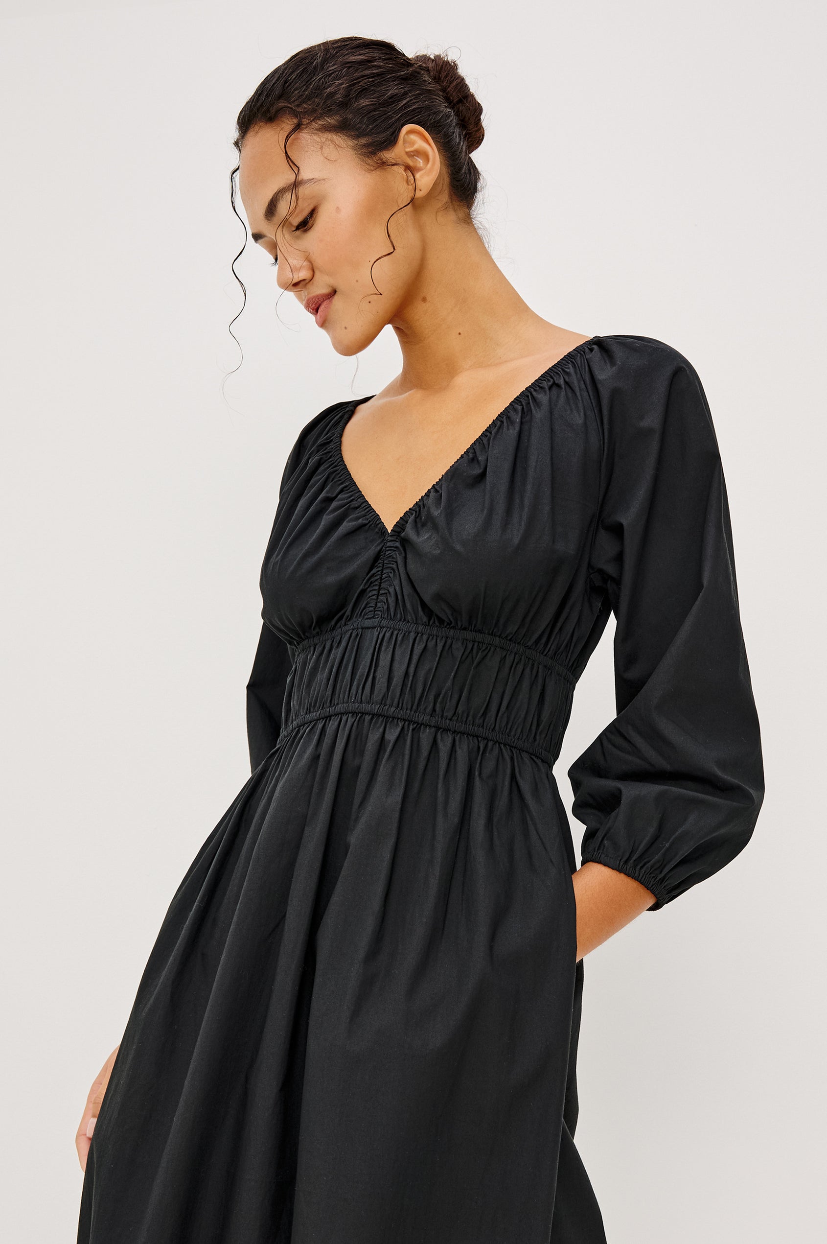Paio Midi Dress in Crinkle Poplin With Elastic V-Neck Waist and Cuffs Bust Keyhole Cut Out and Three-Quarter Sleeves in Black Colorway - Full Body Front View Featured on Model
