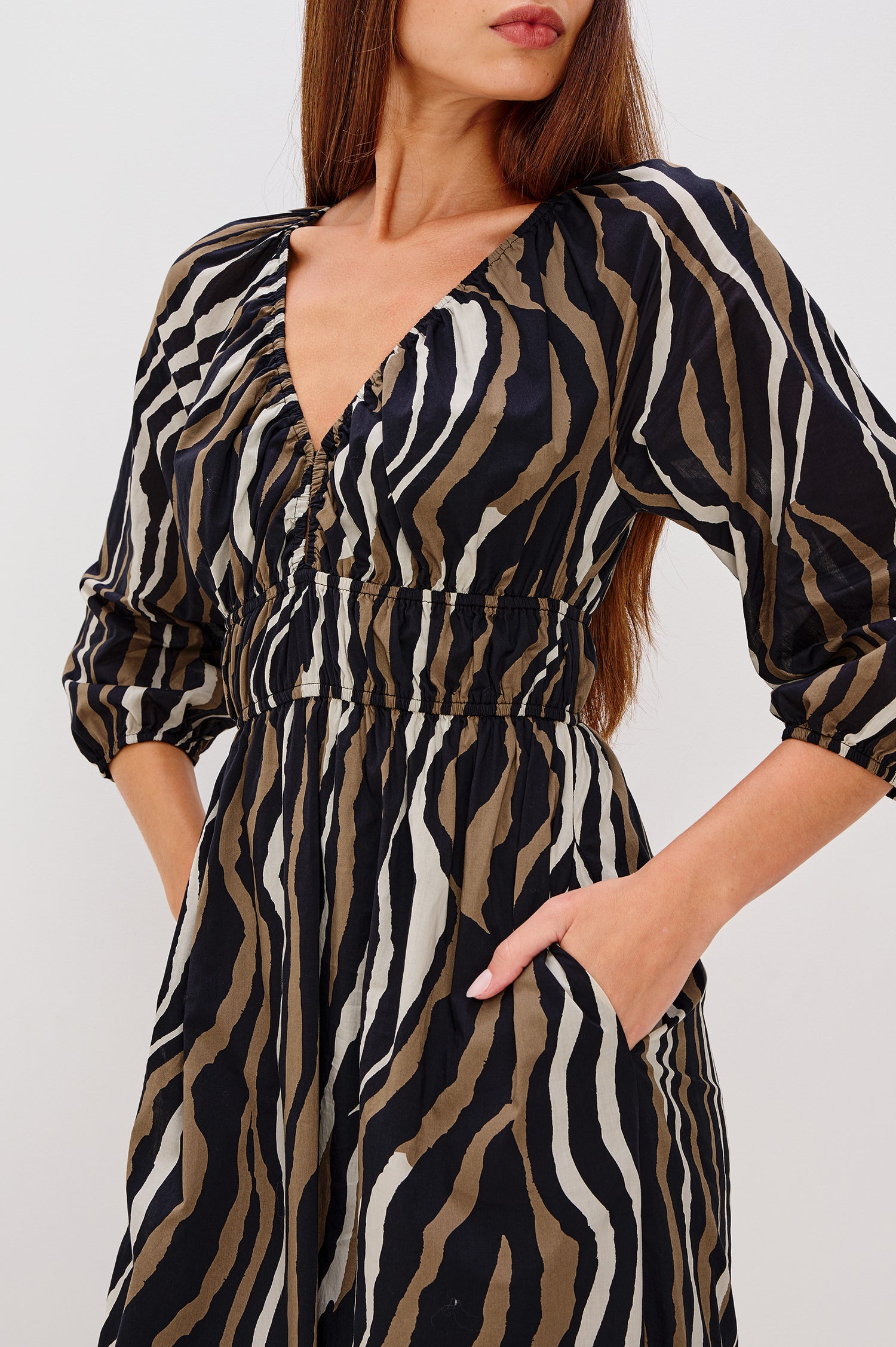 Paio Maxi Dress in Beach Cotton With Absract Print, V-neckline, Front Keyhole Cutout, Long Sleevees With Fitted Cuffs, and Three-Quarter in Canyon Stripe Colorway - Full Body Side View Featured on Model