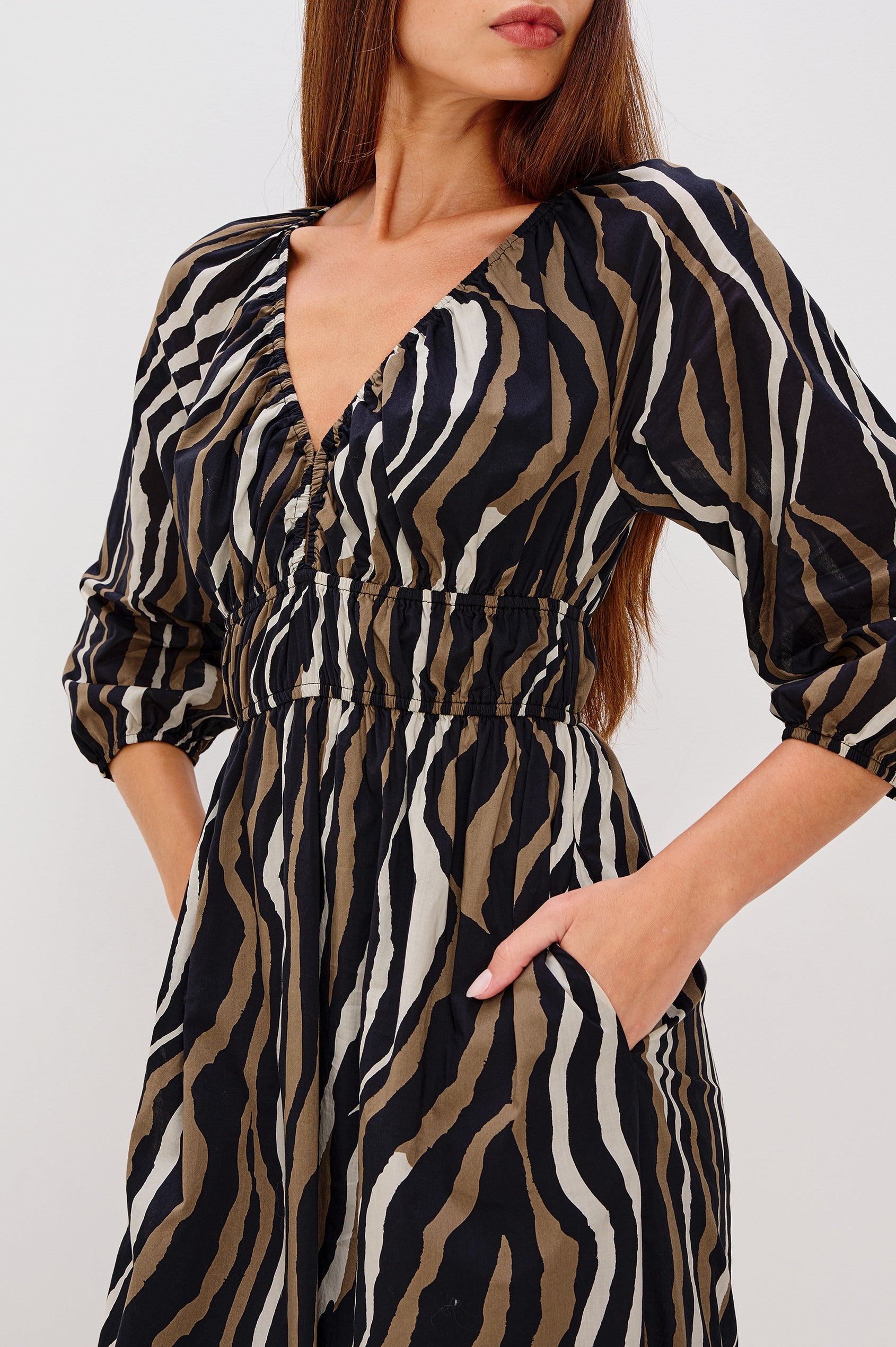 Paio Maxi Dress in Beach Cotton With Absract Print, V-neckline, Front Keyhole Cutout, Long Sleevees With Fitted Cuffs, and Three-Quarter in Canyon Stripe Colorway - Full Body Side View Featured on Model