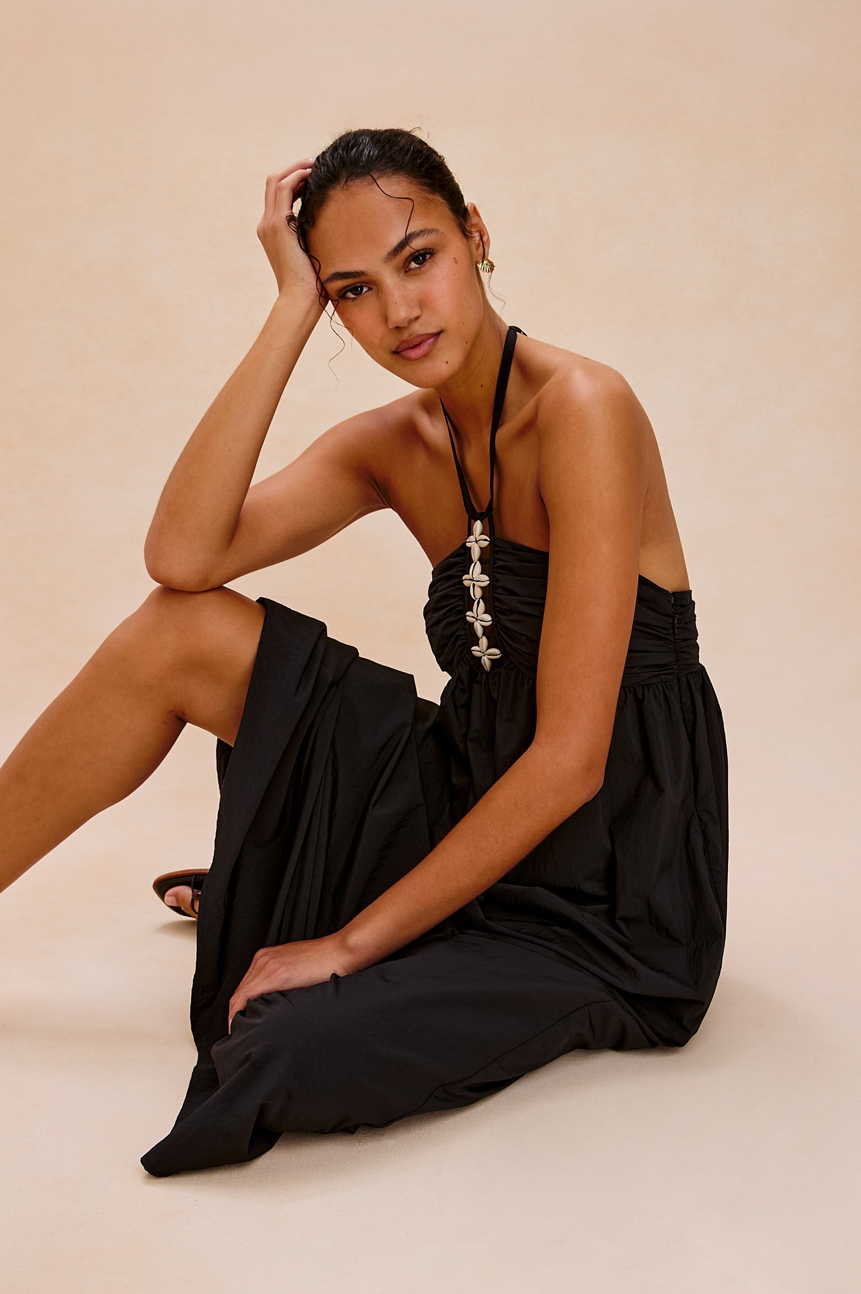 Palazzo Halter Midi Length Dress with Tie Neck and Sea Shell Lattice Detail at Center Front in Black Colorway. Front View Shown on Model.