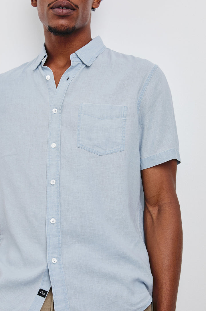 Paros button up short sleeve with front chest pocket in Blue Lagoon - close up of details on model