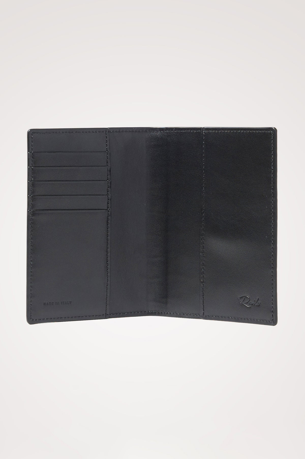 Passport Holder in Croc-Embossed Spanish Leather With Five Card Slots, Two Side Pockets, and Embossed Rails Logo in Black Croc Embossed Colorway - Interior view.