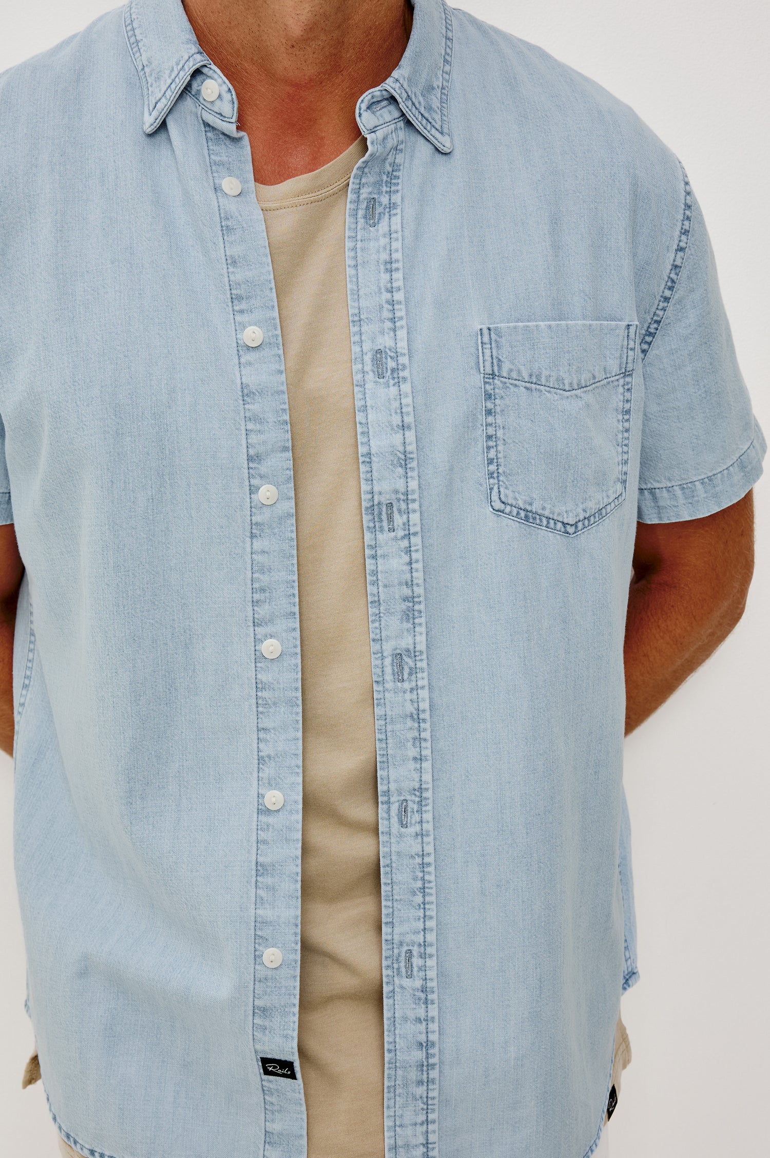 Penn Button-Up Shirt in Rope-Dye Yarn With Collar, Short Sleeves, and Classic Fit in Light Vintage Wash Colorway - Upper Body Close Up View Featured on Model