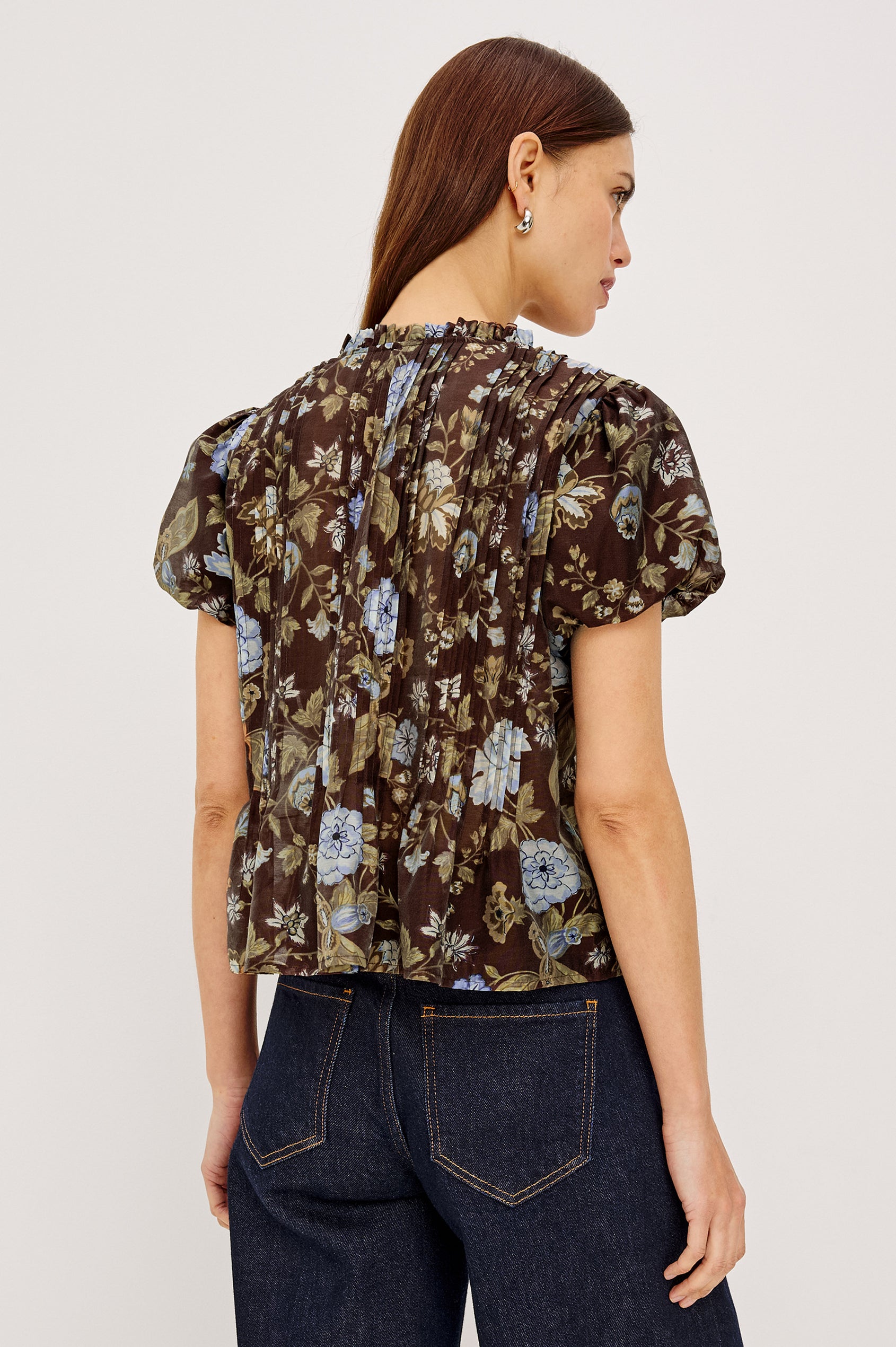 Pepper Shirt in Cotton Poplin With Loose Boxy Fit, Pintuck Detailing, Puff Cap Sleeves, Center-Front Buttons, and Soft Peplum Hem in Willow Colorway - Upper Body Back View Featured on Model