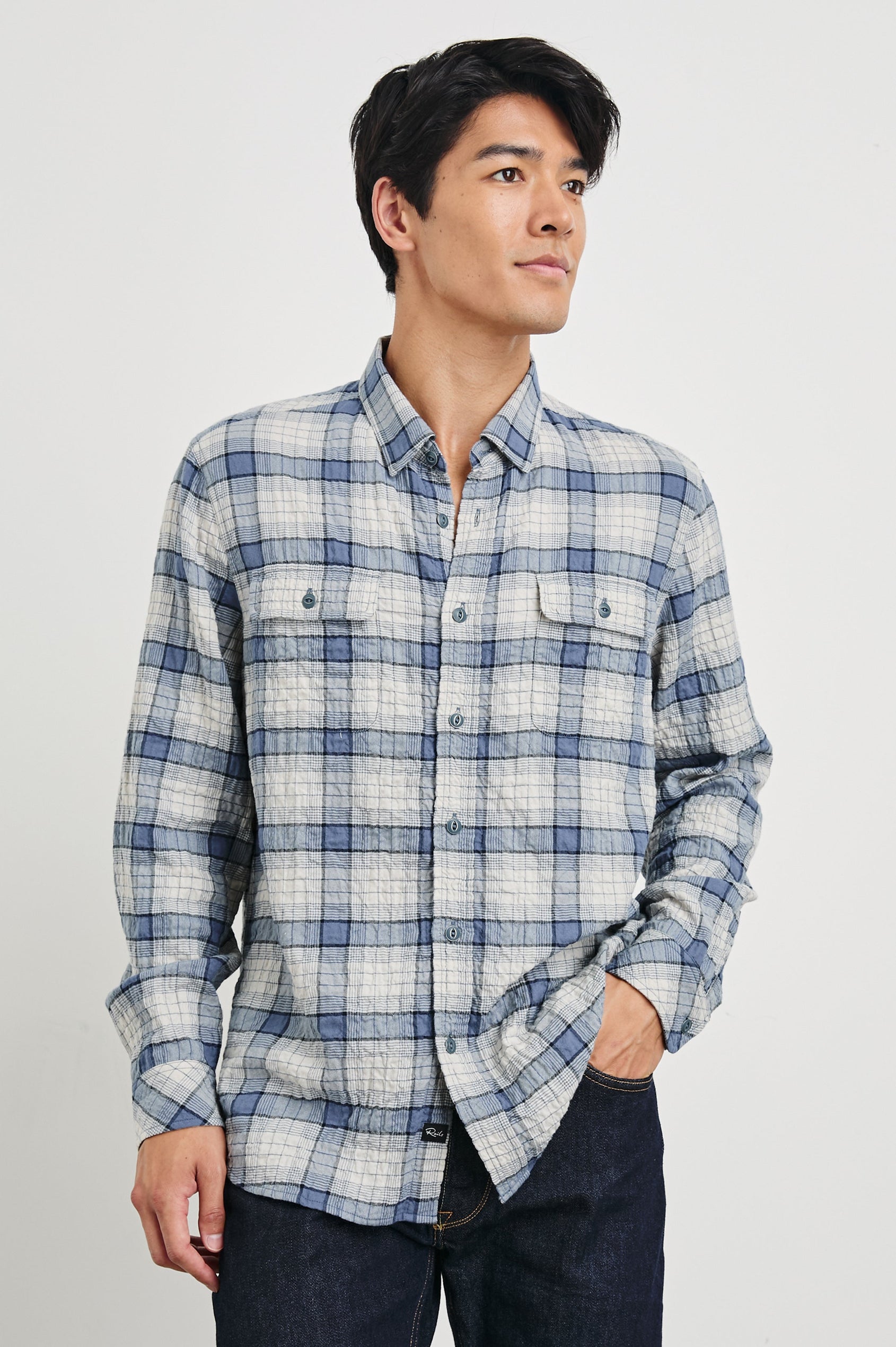 Powell Long-Sleeve Button Up with Textured Cotton and Two Chest Buttoned Flap Pockets in Paper Iris Colorway, a white and blue plaid - Front View Featured on Model