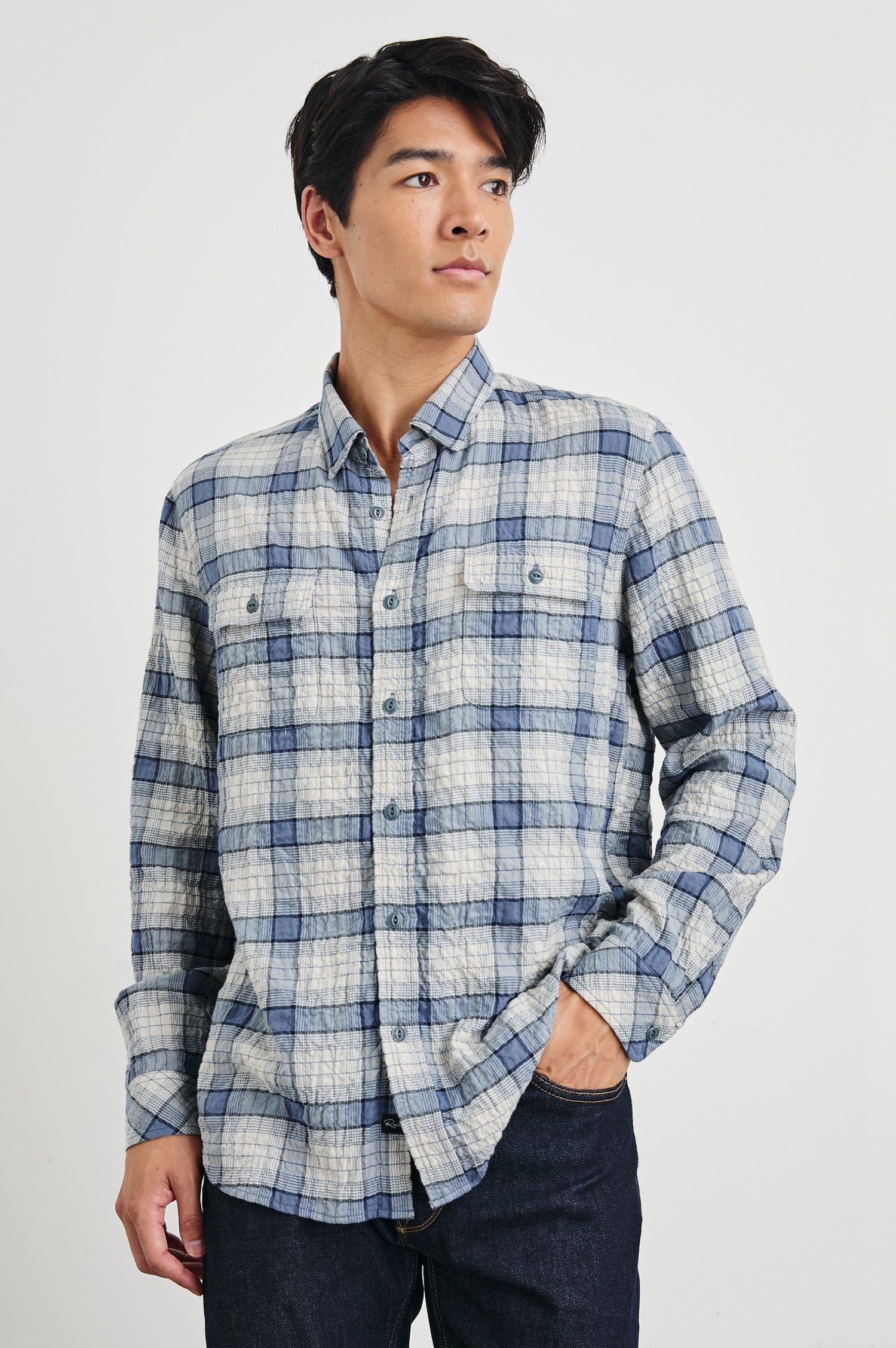 Powell Long-Sleeve Button Up with Textured Cotton and Two Chest Buttoned Flap Pockets in Paper Iris Colorway, a white and blue plaid - Front View Featured on Model