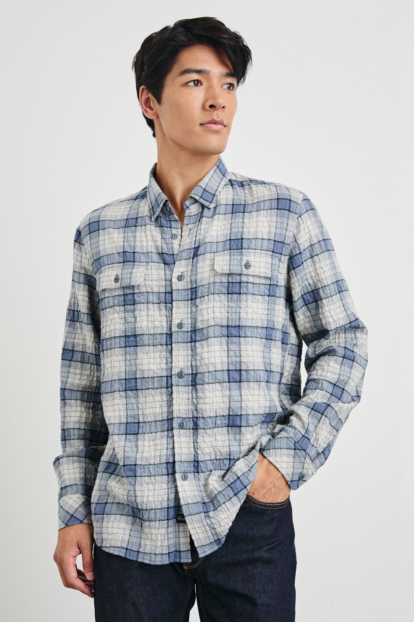Powell Long-Sleeve Button Up with Textured Cotton and Two Chest Buttoned Flap Pockets in Paper Iris Colorway, a white and blue plaid - Front View Featured on Model