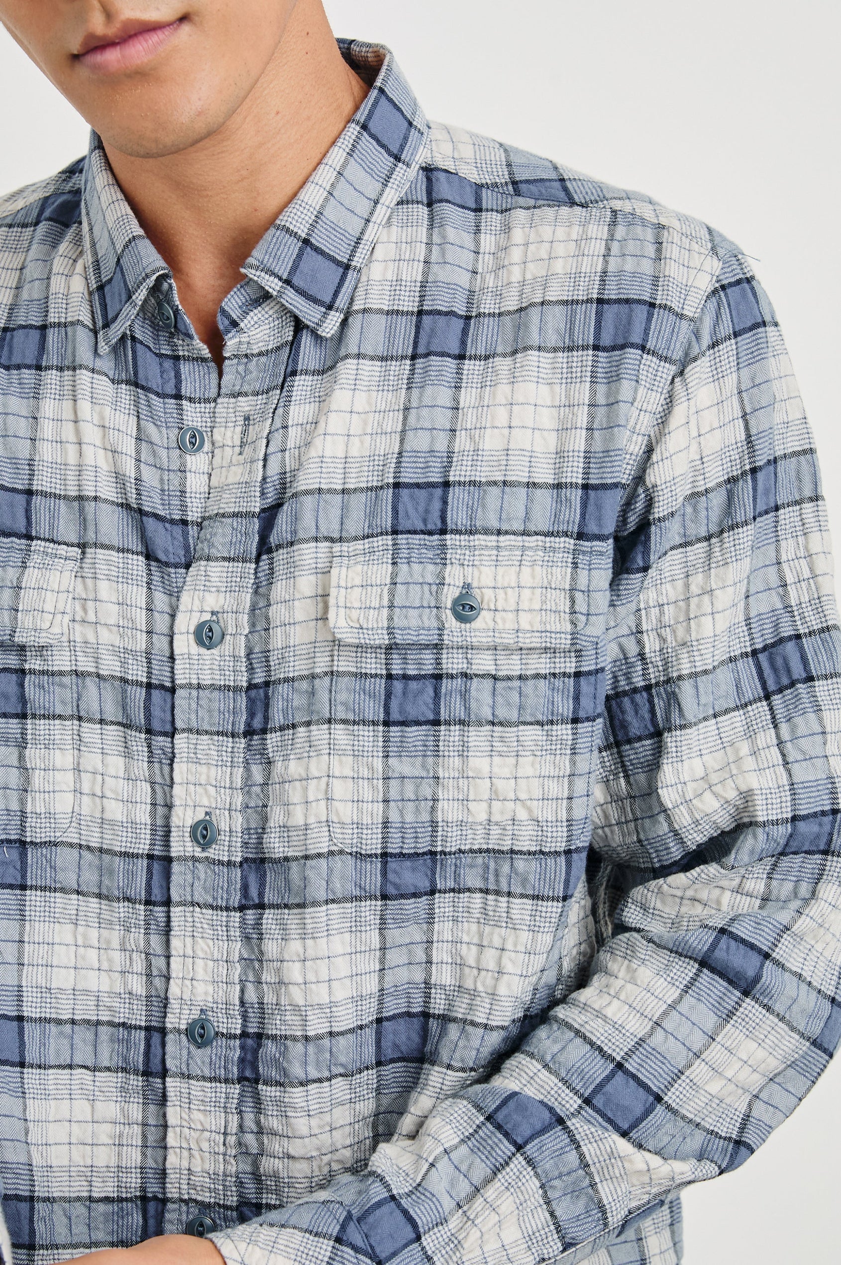 Powell Long-Sleeve Button Up with Textured Cotton and Two Chest Buttoned Flap Pockets in Paper Iris Colorway, a white and blue plaid - Front View Featured on Model